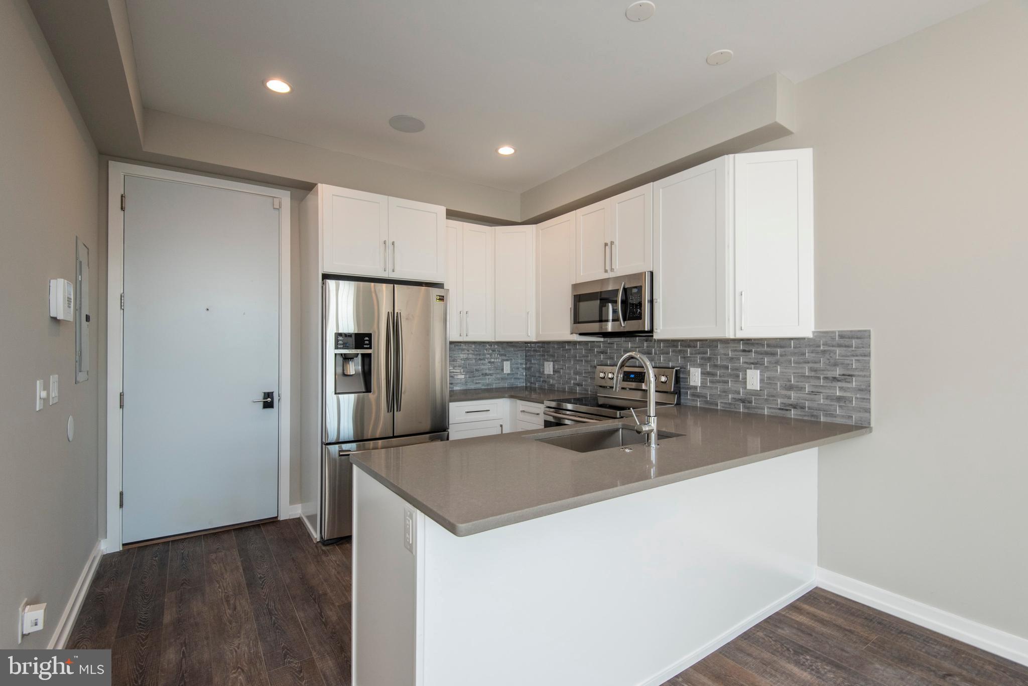 Nestled in the heart of Passyunk Square, The Exile Building is home to 23 brand-new construction, luxury rental units, featuring top-of-the-line finishes throughout. This 1 bedroom apartment has hardwood floors, stainless steel appliances, quartz counters, walk-in closets with custom-built shelving, custom tile-work in the frameless glass-enclosed showers, washer/dryer, recessed lighting, high ceilings with built-in speakers, Nest thermostat, video intercom, and tons of natural light. There is also a huge shared roof deck with beautiful views! In addition to everything we've already mentioned, the building offers a package delivery room, meeting/lounge space, and bike racks, as well as an ideal location across from Columbus Square and close to tons of shops and restaurants on Passyunk Ave.