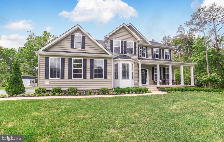 Beautiful colonial on an acre plus lot just 3.5 years old.  This one has upgraded flooring, lighting, and lots of special touches.  Kitchen with 42 inch white cabinets, granite, SS appliances and hardwood. Huge master bath with lots of cabinet space, and extra large tiled walk in shower.  All bedrooms are spacious and have walk in closets.  Owners have recently added an large covered deck and beautiful paver patio, plus professional landscaping.  This is a water access community.  Other community amenities include tot lots, community dock on St Marys River and ball fields.