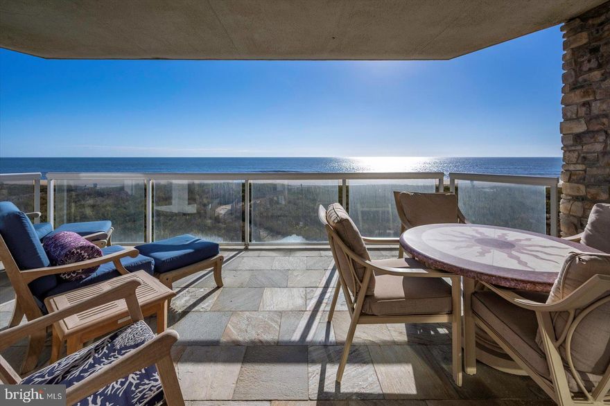 Luxury Direct Oceanfront 3BR/3.5BA Condo, 2,412 sq ft – Boutique Building with Only 4 Units! Experience the ultimate in coastal luxury living with this direct oceanfront 3-bedroom, 3.5-bath condo in one of Ocean City’s most prestigious boutique buildings. With only four residences, this exclusive property offers privacy, sophistication, and breathtaking views from every room. Wake up to the sound of waves and watch the sun rise over the Atlantic from your oceanfront primary suite, featuring private balcony access and a spa-like bath with a soaking tub and separate tile shower. The gourmet kitchen is a chef’s dream, boasting Viking appliances, custom cabinetry, a large prep area, and an elegant wet bar with wine storage—perfect for entertaining. The kitchen flows seamlessly into the dining area and spacious oceanfront family room, where a gas fireplace creates the ideal atmosphere for cozy fall and winter nights.
A wall of glass sliders opens to a private balcony overlooking the ocean—perfect for relaxing and soaking in the sound of the surf and the scent of the sea breeze. This stunning condo is sold fully furnished with high-end designer furniture, plantation shutters, and custom tile work throughout. Each guest bedroom offers its own en suite bath, providing comfort and privacy for family and friends. Luxury, elegance, and oceanfront tranquility await in this one-of-a-kind Ocean City residence. Enjoy the rooftop sundeck. Don't miss this unique opportunity.