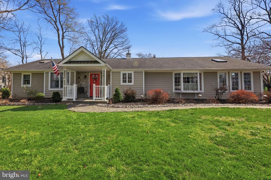 Welcome to this absolutely exquisite expanded rancher nestled in the heart of desirable Yardley, offering refined living within the prestigious Pennsbury School District. From the moment you arrive, the home’s stunning stone front portico with bluestone entry and flooring sets the tone for the elegance found throughout. Thoughtfully enhanced with extensive hardscaping and a newer roof, this residence seamlessly blends timeless craftsmanship with modern comfort. Inside, you’ll find three spacious bedrooms, each featuring its own private bath—perfect for both everyday living and hosting guests with ease.  The fourth bedroom is presently being used as an office. The home’s expansive layout is highlighted by a massive Florida room, showcasing soaring cathedral ceilings, abundant skylights, elegant flooring, and custom moldings that flood the space with natural light and architectural charm. An additional family room mirrors these impressive details, creating multiple inviting spaces for relaxation and entertaining. At the heart of the home is a beautifully designed custom kitchen complete with a breakfast room featuring heated ceramic flooring, a stylish backsplash, double wall ovens, and a full suite of modern appliances—ideal for both casual meals and gourmet cooking.
Additional features include a generously sized laundry room, a large rear patio surrounded by professional hardscaping, and a detached two-car garage. Every detail of this exceptional property has been carefully curated to offer comfort, sophistication, and effortless living. A rare opportunity to own a truly remarkable home in one of Bucks County’s most sought-after locations.