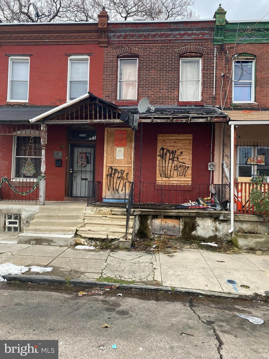 Row house in North Philly within walking distance from Temple.  There is no entry to the house as the house is basically a shell and ready for complete rehab.  All certificates are to be provided by the buyer.   Priced right for that handyman who wants rental income from potential students.