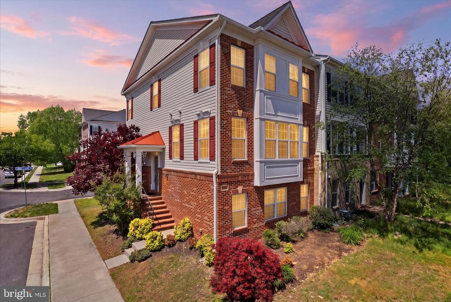The owner has done lots of update such as roof (2025), dishwasher (2025), built-in oven and microwave (2025), gas cooktop (2025), new carpet (2026), new Sherwin Williams fresh paint (2026).  Discover the epitome of luxury living in this exquisite Colonial townhouse, perfectly situated for an exclusive lifestyle. This end-of-row gem boasts 2,426 sq. ft. of meticulously designed space, featuring a fully finished daylight basement with walkout access, ideal for entertaining or relaxation. Step inside to find a warm and inviting ambiance, highlighted by a cozy fireplace that serves as the heart of the home. The attached rear-entry garage offers convenience, while the community pool invites you to unwind on sunny days. Enjoy the seamless blend of elegance and comfort, with high-end finishes throughout. This residence is not just a home; it's a sanctuary where every detail has been thoughtfully curated. Embrace a lifestyle of sophistication and leisure, surrounded by the finest amenities. Your dream home awaits!