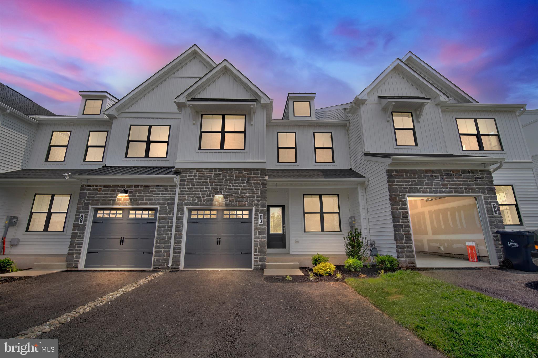 Quick delivery Standbridge Elite model Lot 10 will be ready for a July/August move in! When you arrive to your home you will immediately notice the modern farmhouse exterior with white siding, black windows, stone accents, shed dormer and metal accents. As you enter the foyer, you will instantly appreciate the livability of the open-concept Standbridge home design. The main living level of this home features a private study, large great room, impressive kitchen and dining area. Designer hardwood flooring flows throughout the entire first floor. In the kitchen you will discover white shaker cabinets, quartz counter tops, ceramic tile backsplash, stainless steel GE Profile gas range, dishwasher, and microwave. Off the kitchen is a dining room which leads you onto your large composite deck with steps to your rear yard. It will be on this deck that you can appreciate your private treelined rear yard. Upstairs, the impressive owner's suite is the perfect place to unwind at the end of the day with its volume ceiling, large walk-in closet, and spa-like owners€™s bath with designer ceramic tile throughout. 2 additional bedrooms, a hall bathroom, and a nicely sized laundry room can also be found on this level of the home.
Fall in love with Wheatley Walk, a conveniently located neighborhood of 17 two-story townhomes at the center of it all in Upper Gwynedd Township, PA. Wheatley Walk beautifully combines contemporary exterior architecture and designer-inspired interiors to create a home that is sure to impress both inside and out. The attached photos are of our spectacular Standridge model.