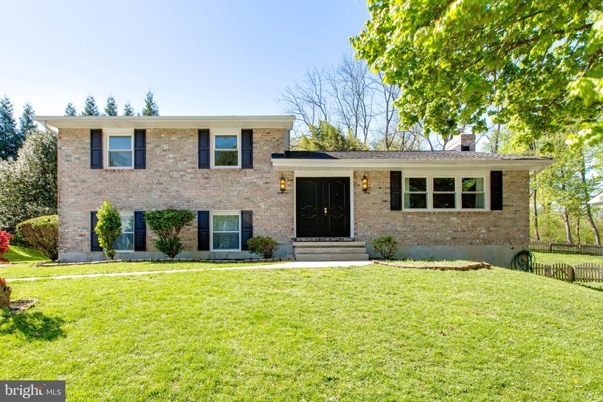 Welcome to this beautifully updated 4-bedroom and 3-full bath home that offers a fresh and modern feel throughout. The main level features refinished hardwood floors and a bright, open layout that leads into a brand new kitchen complete with soft-close cabinetry, quartz countertops, and stainless steel appliances. All three bathrooms have been fully updated with floor-to-ceiling tile work and high-end fixtures. Significant updates to the home's exterior and systems include new windows and updated siding (2026); a newer roof, HVAC system, and water heater (2022); and a serviced, updated chimney with a new stainless steel liner and rebuilt crown. The interior is finished with fresh paint and updated lighting, including new ceiling fans and a chandelier in the dining area. Outside, the large covered deck has been refreshed with new railings and overlooks a professionally landscaped and graded yard. This move-in ready property is conveniently located near major commuter routes, shopping, and dining.