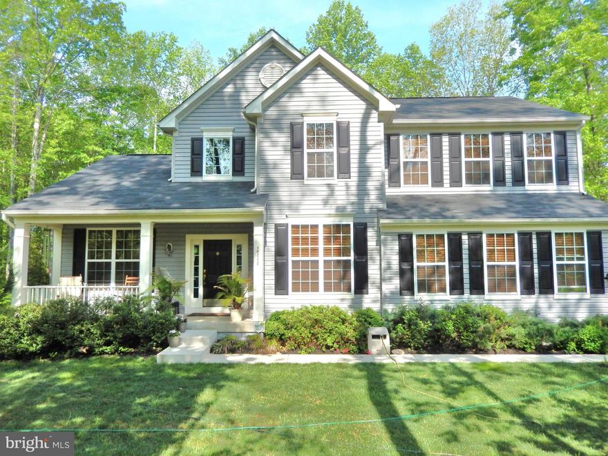 Why wait to build?! This home on Large Lot is move-in ready.  3 finished levels!!  Gourmet Kitchen w/ stainless & Granite. SUNROOM w/ vaulted ceiling.  Large FR w/ fireplace. Main floor Office.  Master retreat w/ walk-in closet. Mbath w/upgraded tile, sep shower, soaking tub & dual sinks. LL has rec room,5th bd (NTC) & full bath.   Enjoy the serene lot from the porch or deck.  Side Load Garage!