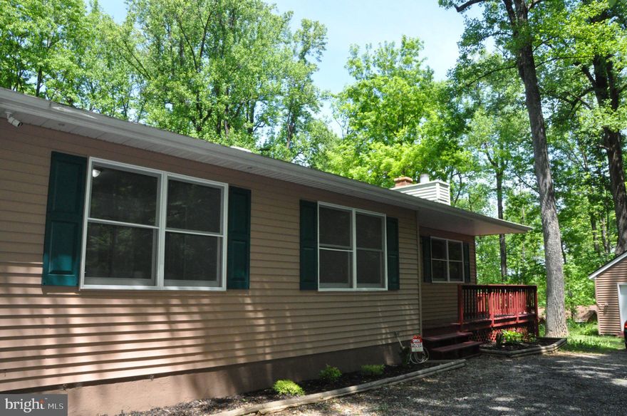Reduced. Gorgeous home situated on a spacious 0.62-acre lot in the highly sought-after Blue Mountain area! This beautifully updated property features upgraded appliances throughout, along with a roof approximately 10 years old for added peace of mind. The main level offers 3 generously sized bedrooms and 2 fully renovated bathrooms, complemented by new flooring, fresh paint, and modern finishes throughout. Step outside onto the expansive wrap-around deck—perfect for relaxing or entertaining while enjoying serene, scenic views. The walkout lower level adds exceptional versatility and includes a luxurious full bathroom, along with a brand-new washer and dryer for your convenience. Ideally located just minutes from I-66, the Shenandoah River, and the Appalachian Trail, this home combines comfort, style, and accessibility.
A true must-see!