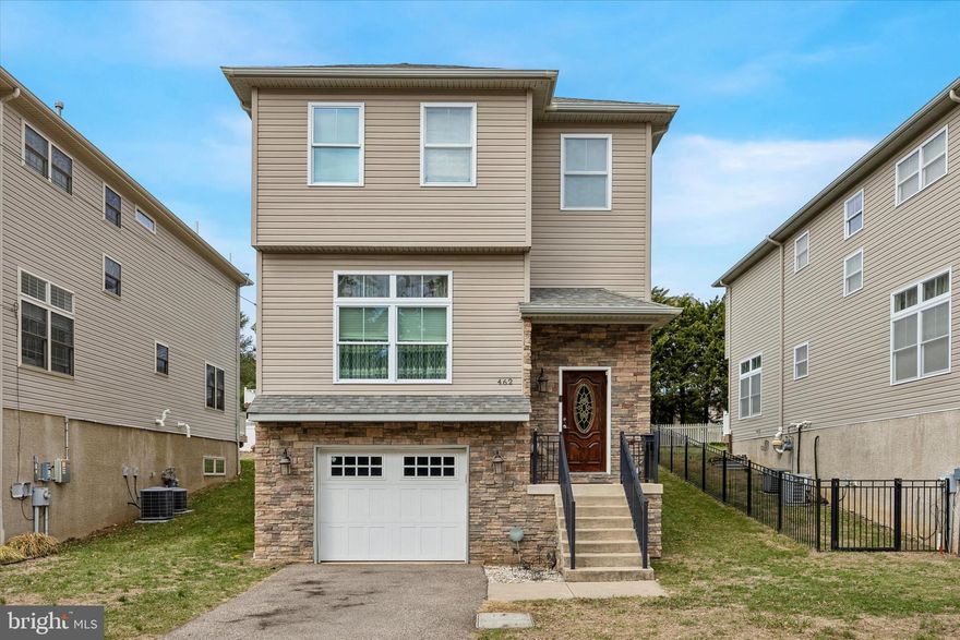 Presenting 462 Oriole Street Philadelphia. This is your chance to own a Single-Family, Detached home in the premier part of the Roxborough / Dearnley Park neighborhood! Dearnley Park is a 4 street section of Roxborough, stretching down to the Schuylkill River, so named as it is the former site of the Dearnley Park Mansion. 462 Oriole sits at the highest point of Dearnley Park. The actual site where the Mansion was! The home delivers 3 Bedrooms, 4 Bathrooms, 2 Family Room spaces and 2,735 Square Feet of Finished Living space!! Upon arriving at the home, you will notice the quiet, suburban feel of the street with tons of parking and well looked after houses. Entering through the Foyer, you are immediately greeted with the feeling of how expansive and light filled the home is. To your right are the steps leading down to the Lower Level Basement, as well as the Powder Room. To your left is the Dining area, as well as the steps leading to the Top Floor. Directly in front of you, is the heart of the home, the expansive, light-filled Main Floor, boasting gorgeous wooden floors, tons of windows and providing you with an open-concept Kitchen, Breakfast area and Family Room. This is the space where you and your loved ones will gather and enjoy being in the home together. The Kitchen delivers newer high end Appliances, an abundance of Countertop and Cabinet space and a Breakfast Bar to sit and eat at. Parallel to the Kitchen is an area perfect for a large table that can be used for day to day meals when you don’t want to use the Formal Dining area. The huge Family Room boasts a Coffered Ceiling, Ceiling Fan, Recessed Lighting, Fireplace and Sliding Door access to the Deck and large Rear Yard. Heading upstairs, you will find the Primary Suite, complete with a large Bedroom, a separate nook that is perfect for a Home-Office, a Walk-in Closet, 2 other Closets, another Fireplace and a luxurious Primary en-suite Bathroom, that delivers a Stall Shower and Granite Double Sink Vanity. The Upper level also provides 2 more good sized-Bedrooms, one with a huge Walk-in-Closet of its own, a Full Hall Bathroom with a Tub-Shower and its own Granite Double Sink Vanity, the convenient and big Laundry Room and access to the Attic that is perfect for additional storage. Downstairs, you will love all the bonus spaces, including a finished second Family Room, another Half Bathroom, 2 huge Storage spaces (they are almost mini rooms) and interior access to the Garage. If you are looking for a home that is in Philadelphia, but feels like you are in the Burbs, 462 Oriole is the place for you! Ready to move in without doing any work and offering extra features such as a Radon Mitigation system, rounded corners on the drywall throughout the house, and Garage, Driveway and easy Street parking, this house is just waiting for you to make it your home. Located in the Green Wood Charter catchment area and a short walk to Shawmont Elementary school, 462 Oriole is also conveniently located to the Roxborough YMCA, Morris Arboretum, Jefferson University, Wissahickon Valley Park, the buses on Ridge Avenue, Train Stations, Manayunk’s Main Street, the Schuylkill Expressway, Conshy, Plymouth Meeting and Downtown Philly. The home has some custom curtains throughout that are negotiable. Schedule your showing today!