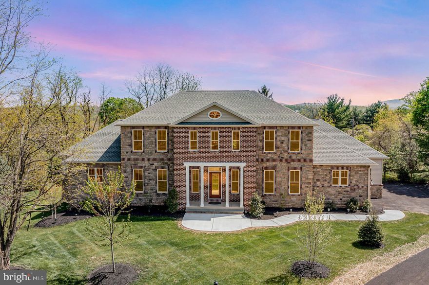 Discover Luxury and Spacious Living in this Magnificent Brand-New, Move-In Ready, 5 Bedroom, 4.5 Bathroom Family-Home with a Full-Finished Walkout-Basement, situated in a peaceful-serene estate-style community on a private cul-de-sac. The impeccable design blends with the surrounding homes, offering a visually stunning exterior that captures the essence of sophistication and elegance. Step inside to encounter high-end finishes and contemporary design, with an extensive amount of open-interior space and tailored living areas to meet the needs of any family. The grand great room features a two-story end wall, complemented by stone and wood accents, a warm gas fireplace, and an abundance of natural light. Adjacent to the great room, the well-appointed kitchen and dining room are the perfect spaces for entertaining. The kitchen comes equipped with all GE Cafe appliances, two sinks, soft-close cabinets & drawers, under-cabinet lighting, Quartz countertops, and a walk-in pantry.  Relax in the luxurious 1st-floor master suite with a gas fireplace, complete with a beautiful spa-like master bathroom with heated floors, dual sinks, a soaker tub, a designer shower with body spray, a rain-shower head, blue tooth speakers, and his and her walk-in closets. The main level also offers a living room, an office, a mudroom, a half bathroom, a laundry room, a wet bar with a wine cooler, a covered deck with views of Ski Roundtop, and an oversized 3-car garage with quiet-close doors and Epoxy, non-slip garage floors. On the second level, enjoy an open lounge area overlooking the great room, another wet bar with a wine cooler, 4 spacious bedrooms with large closets, and 2 full bathrooms. Two of the bedrooms have access to a Jack-and-Jill bathroom, while the other two share hall access to another full bath. The finished walk-out basement or potential in-law quarters is a highlight of this home, featuring a 2nd full kitchen with Quartz countertops, soft-close cabinets & drawers, Samsung appliances, an exercise room that could easily become the 6th bedroom, a covered patio, and a wealth of entertaining and storage space. With plenty of open space throughout this home, every aspect of family living and entertaining is supported by this beautiful home. Set on a .78-acre lot, there are many opportunities for entertaining, grilling, playing, or even a future swimming pool. This home is located in a Private-Convenient area yet only minutes from dining, shopping, and major highways such as Route 15, 581, and the PA Turnpike. In addition, the entire home is equipped with a 400-Amp service.