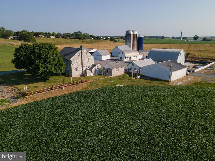 SELLING FOR TRUMAN & CORA MARTIN  -  OUTSTANDING  84+- ACRE HIGH PRODUCING WASHINGTON COUNTY, MD FARM! This farm has been in the same family since 1868! This is the opportunity of a lifetime! A beautiful limestone home built in 1949 greets you as you enter the farm lane. The home features 4-5 bedrooms, Kitchen with fridge, stove, and dishwasher conveying, Sewing room w/ two built in ironing boards, Living room, Family room, Dining room, Mudroom, 2 bathrooms, laundry shoot, and a partially finished basement. Outside of the home is a 14x20 limestone wash house with many potential uses. There is also a 3 car 19x26 detached garage with a 14x19 workshop. Farm Buildings include: 38x51 Loafing barn with center feed bunk and automatic waterer, 2 bay garage/workshop with the bays measuring 13x25 and 14x25 w/ loft, 14x17 milk house (tank has been removed), 17x26 double 4 milking parlor ( equipment has been removed), 26x50 holding area which holds approx 130 head, 30x40 equipment shed w/loft, 36x50 barn w/loft, 28x44 equipment shed, 103 stall 50x140 free stall barn, 38x42 equipment shed/ loafing area, (2) 20x60 stave silos, 20x55 harvestore silo, approx 300,000 gallon lagoon, generator hook up for house. This is the opportunity of a lifetime to own a beautiful farm with tons of potential. This property will be offered at auction on Friday September 8, 2023  @ 1:00pm. List price in no way represents minimum, starting, or acceptable bid. It is used only as a guide to find the home.
