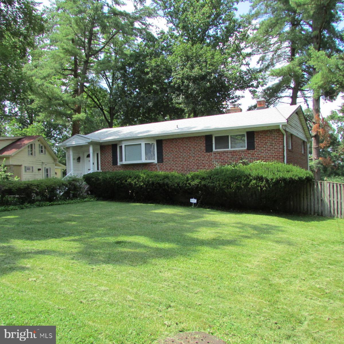 This lovely home is a must see. With 4 spacious bedrooms and 2 full baths, it offers lots of space for comfortable living and entertaining. The beautiful wood floors are easy to maintain and compatible with any decor. Whip up a gourmet meal in the beautifully updated kitchen and serve it in the light-filled dining room or the expansive deck. Need more space? Transition to the huge, lower-level family room with wet bar and fireplace. Too may features to mention. This house has everything you need.