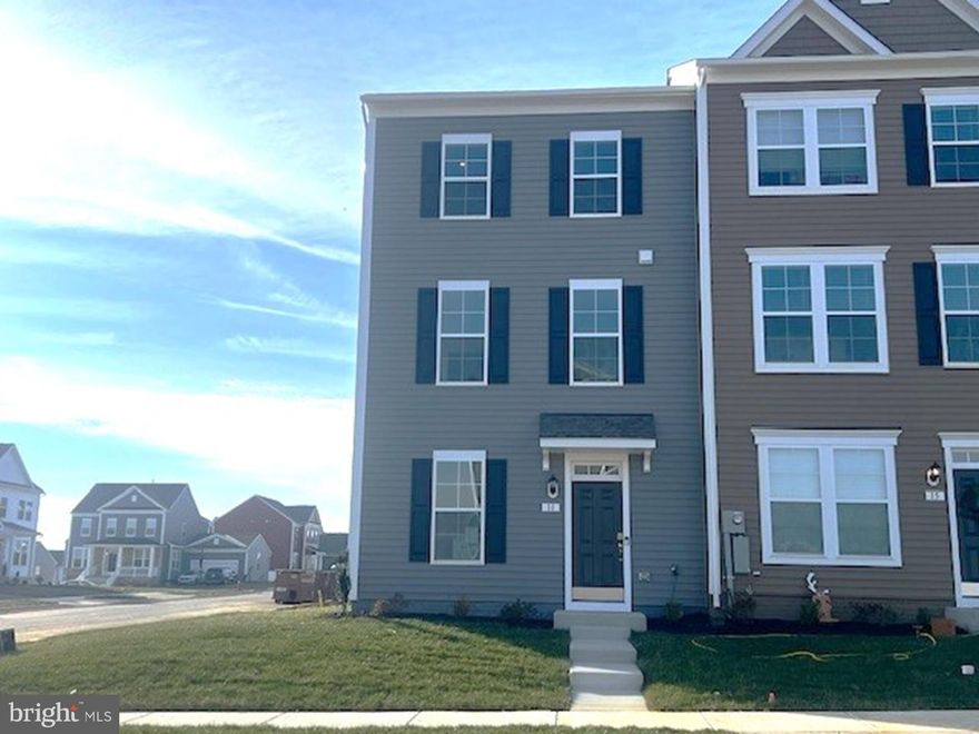 The only community within historic Charles Town with resort style amenities! 
**Cover Your Closing Cost Up To $18,000, Paid by DRB Homes and Lender Credit for Primary Residence with Use Of approved Lender and Title!**
 Brand New Construction Available in Jefferson County’s premier planned community. This End Unit 3 Bedroom, 3.5 Bath, spacious foyer, and a double coat closet, upon entering. The bottom level includes a room which could b e used as an office/study or 4th bedroom, a full bathroom and rec room! The second level is an open concept oversized kitchen with a large island, stainless steel appliances, upgraded cabinets, Quartz countertops, backsplash, luxury vinyl plank on entire level, and it opens to the morning room and living room. This home features our alternate main floor option, which truly creates an open concept from the front of the home to the back. The primary suite features a large walk-in closet, dual vanity, and a large separate shower. Laundry is located on the bedroom level. The home is complete with a private 2 car rear parking pad.