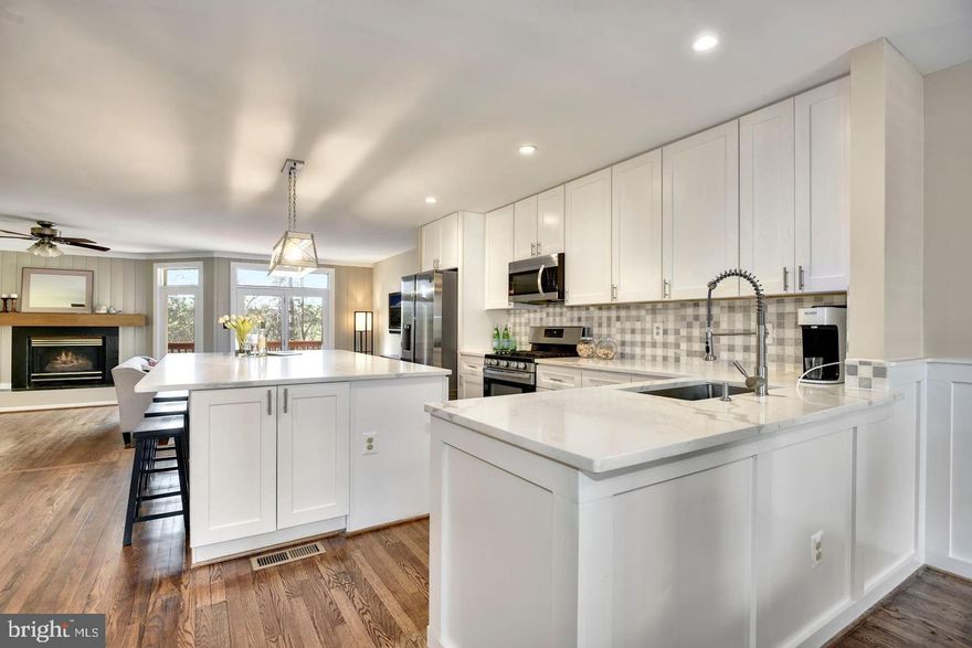 Elegantly renovated three-level townhouse available for rent in Fair Lakes. Impress guests in the brand-new kitchen featuring a spacious center island, marble countertops, floor-to-ceiling solid wood cabinets, and state-of-the-art Samsung appliances. The main level includes a separate dining room, a living room with a fireplace and access to a private back deck, as well as an updated powder room. Upstairs, three generous bedrooms and two fully renovated bathrooms await. The primary bedroom boasts an ensuite bath with a double shower booth featuring standing glass, all-porcelain tiles, and a new white marble top double vanity. The second full bath has been updated with a new soaking tub, marble tiles, porcelain tiled floor, and a new vanity. All three bathrooms feature new toilets. The lower level offers a spacious den and a separate entrance to the back patio. This home boasts hardwood floors, fresh paint throughout, a detached one-car garage, and access to community tennis courts. Please note that the property is tenant-occupied. Showings must be scheduled online with ShowingTime. To maintain cleanliness, kindly remove shoes or use the provided booties and switch off lights after viewing