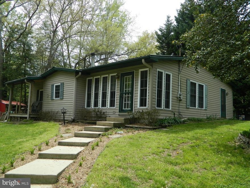 Nice rambler sits atop a hill.  2 beds 2 baths, and everything is new.  Owners have replaced all doors, windows, refinished flooring. updated kitchen, and baths.  Ready for new tenants.  Private location.  Pets case by case.  No smokers. Listing agent will run credit