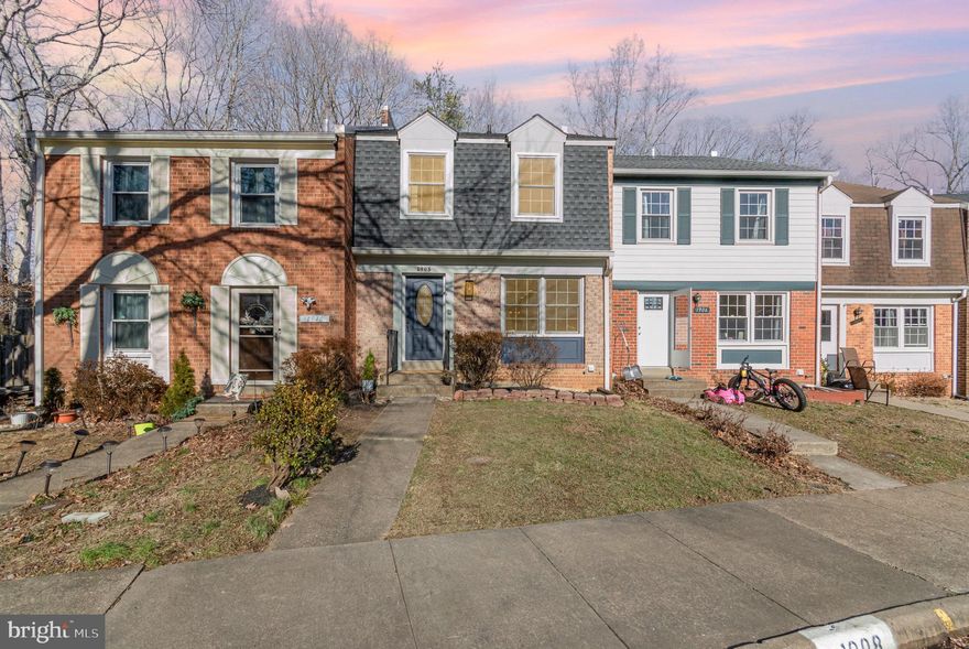 Charming colonial brick 3-level town-home, fully renovated with traditional style and modern amenities.  3 BR, 2.5 BA, freshly painted inside and out.  New contemporary IKEA kitchen with added storage, eat-in area, durable quartz countertops, energy efficient stainless steel appliances plus a wine fridge/beverage center.  Open dining/living area with wallpaper and chair rail, luxury vinyl flooring throughout.  Main level includes a stylish powder room to impress and a deck that looks out to peaceful greenery.  Upstairs, the primary bedroom has two large closets and updated en-suite 3-piece bath.  New quality carpet on all bedrooms.  Renovated hall bath with new tub/shower system.  Walkout finished basement includes large living area and laundry room.  Sliding doors lead to patio with added deck area for entertaining/ barbecuing.  New roof and many newer systems, including HVAC, Hot Water Heater.  Newer replacement windows by Anderson.  All new LED lighting.  Great location in the Thousand Oaks community of Lake Ridge, with 2 assigned parking spaces.  Includes Thousand Oaks community pool.  Convenient to shopping and commuter options.