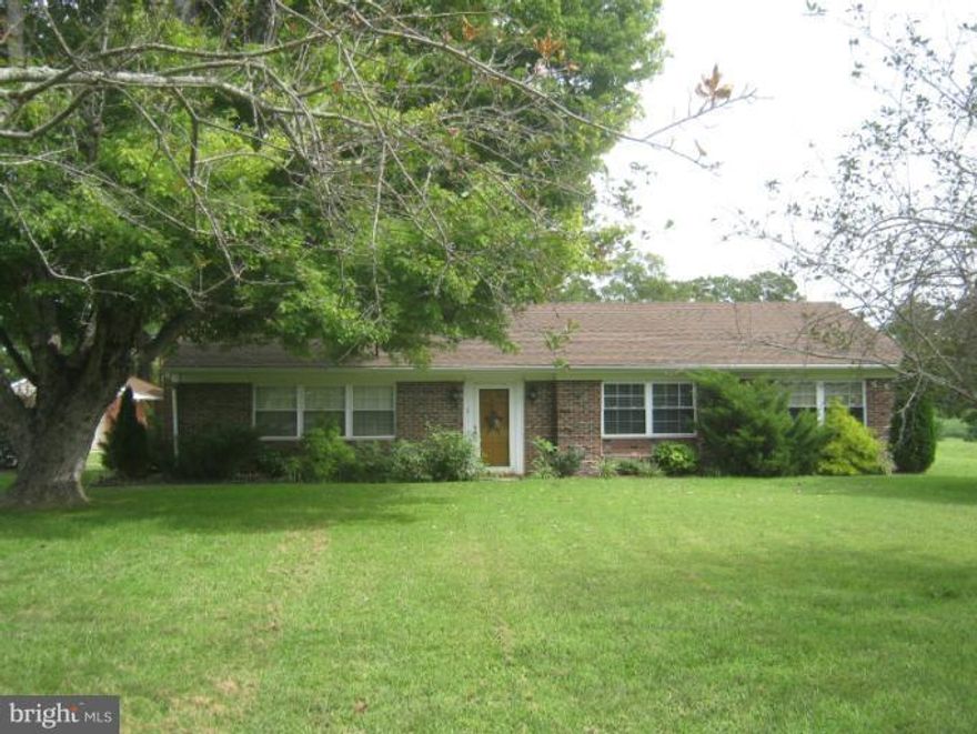 Three season porch with tile floor - goes to deck.  Built-in corner cabinets and bookcases in living room.  Large 28' x 48' pole building with 10' doors, electric & gas heater and paved driveway.