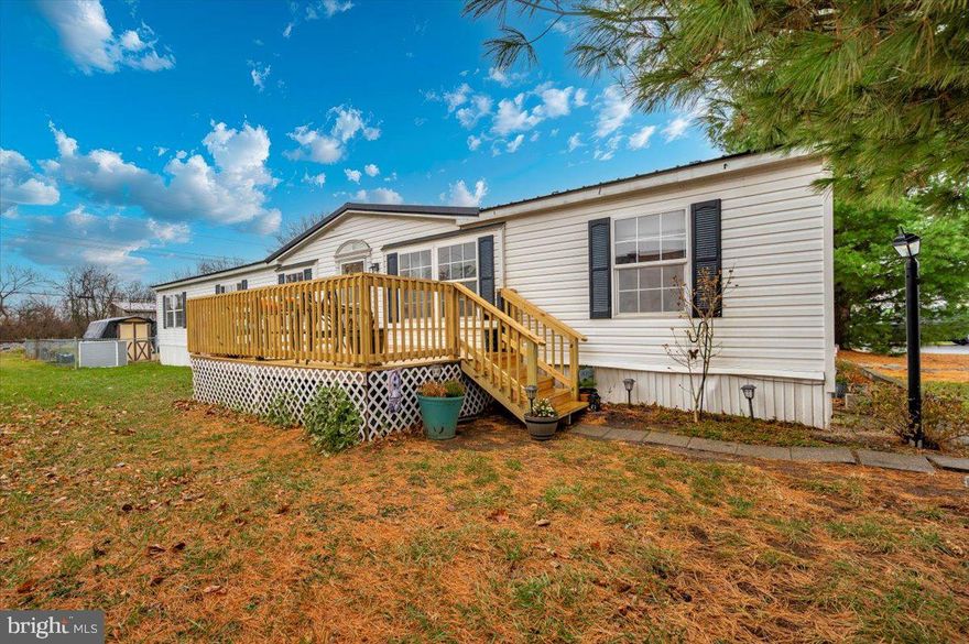 AN ABSOLUTE MUST SEE! **Prior to scheduling a showing, please explore special financing options - recommended lenders in agent remarks - Special Notes At Bottom Of Description** This 4 bedroom w/den, 2 bathroom home is over 1600 square feet and located in the highly sought-after Royal Crest Estates! This home comes with a ton of upgrades including a newer roof, hvac, rear deck, flooring, front deck, rear deck, large flat backyard, living room fireplace, and a beaufully designed open concept perfect for the entire family! This one will not last long, so schedule your showing today! *Backyard fence and above ground pool do not stay with the property due to Park rules.*