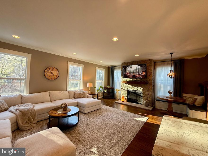 BEST VALUE IN THE AREA - this is a RARE OPPORTUNITY, home has been consistently called ABSOLUTELY GORGEOUS by local agents in their feedback.  The recent complete remodel makes this as close to being a  brand new custom home without the brand new price tag! PRICED TO SELL and MOVE IN READY. This motivated seller is relocating due to a job transfer - their loss is a BUYER'S DREAM! Don't take our word for it, schedule your private showing to see this PINTEREST-WORTHY AND TRULY INCOMPARABLE home! Beautiful CUSTOM REMODELED end-unit townhome tucked on a quiet cul-de-sac and backing to woods, prime location just minutes to Short Pump and major highways (all the convenience without the traffic). Sun-filled with windows on three sides (E/S/W), featuring hand-scraped solid hardwoods, matte black appliances and fixtures, a stacked-stone fireplace with reclaimed wood mantel, GE Café kitchen, spa-inspired baths, beautifully appointed bedrooms, and a flexible lower level with full bath. No detail overlooked.  TURNKEY LUXURY!!!   Open floor plan lives like a traditional SFH without the maintenance. Oversized fenced yard + 2-car garage + low HOA.  Window treatments, 2 - new 65" mounted TV's, extra refrigerator, barstools can convey. Seller will consider selling furnished. Seller offering one-year FULL-MEMBERSHIP TO AWARD-WINNING ACAC FITNESS CLUB in Short Pump for up to 5 (household) members.  Includes SHORT PUMP ROOFTOP POOL AND BAR – located just one mile from home, PLUS UNLIMITED VISITS TO MIDLOTHIAN WATERPARK and outdoor tennis courts!