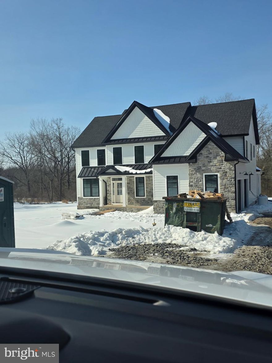 M Gold Building Group presents quality New Construction, currently under construction. A custom 5600 sq ft 4 BR, 3.5 BA home on a gorgeous 1.6-acre lot. This is a must-see home with luxury details and thoughtful touches added throughout including 2x6 exterior walls, Viwinco series black windows, James Hardie plank siding, partial stone front, wide plank hardwood floors throughout the entire house, custom crown molding, ceiling fans, luxury baths with Century cabinetry  & custom lighting including 100+ recessed lights throughout. A large, open 2-story foyer with staircase overlooks a 2-story Family room with floor to ceiling stone gas fireplace . Formal LR & DR with tray ceiling & wainscoting. Gourmet Kitchen with custom cabinetry by Century Kitchens and Quartz counter tops, high-end stainless steel appliances. Mudroom off kitchen with built-in bench & custom shelving with access to 2+ car attached garage with insulated garage doors. 24x24 covered patio off kitchen with full floor to ceiling  wood burning stone fireplace. Hall off of Family room leads to large 1st floor Study & Powder room.  Den with double glass doors. Oak stairs with poplar risers and painted balusters lead to the 2nd-floor landing with hardwood floors that overlooks the Family room below. Primary Bedroom Suite with double door, tray ceiling, large walk-in closet & luxury bath with  seamless glass shower enclosure with dual heads, double vanity & free standing luxury bath. 3 additional large bedrooms all offer walk-in closets. Jack & Jill bathroom between 2nd & 3rd Bedroom, Full Hall bath with double vanity & tub/shower. Convenient 2nd floor Laundry room with large closet & attached Utility room. Full, walk-up finished Basement with 9' ceilings & bonus room with full bath. 2 -zoned central air & gas heat. Poured concrete foundation. Full glass front &side doors. Every room is wired for cable.  Don't miss this beautiful custom home!