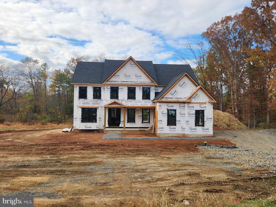 M Gold Building Group presents quality New Construction, currently under construction. A custom 5600 sq ft 4 BR, 3.5 BA home on a gorgeous 1.6-acre lot. This is a must-see home with luxury details and thoughtful touches added throughout including 2x6 exterior walls, Viwinco series black windows, James Hardie plank siding, partial stone front, wide plank hardwood floors throughout the entire house, custom crown molding, ceiling fans, luxury baths with Century cabinetry  & custom lighting including 100+ recessed lights throughout. A large, open 2-story foyer with staircase overlooks a 2-story Family room with floor to ceiling stone gas fireplace . Formal LR & DR with tray ceiling & wainscoting. Gourmet Kitchen with custom cabinetry by Century Kitchens and Quartz counter tops, high-end stainless steel appliances. Mudroom off kitchen with built-in bench & custom shelving with access to 2+ car attached garage with insulated garage doors. 24x24 covered patio off kitchen with full floor to ceiling  wood burning stone fireplace. Hall off of Family room leads to large 1st floor Study & Powder room.  Den with double glass doors. Oak stairs with poplar risers and painted balusters lead to the 2nd-floor landing with hardwood floors that overlooks the Family room below. Primary Bedroom Suite with double door, tray ceiling, large walk-in closet & luxury bath with  seamless glass shower enclosure with dual heads, double vanity & free standing luxury bath. 3 additional large bedrooms all offer walk-in closets. Jack & Jill bathroom between 2nd & 3rd Bedroom, Full Hall bath with double vanity & tub/shower. Convenient 2nd floor Laundry room with large closet & attached Utility room. Full, walk-up finished Basement with 9' ceilings & bonus room with full bath. 2 -zoned central air & gas heat. Poured concrete foundation. Full glass front &side doors. Every room is wired for cable.  Don't miss this beautiful custom home!