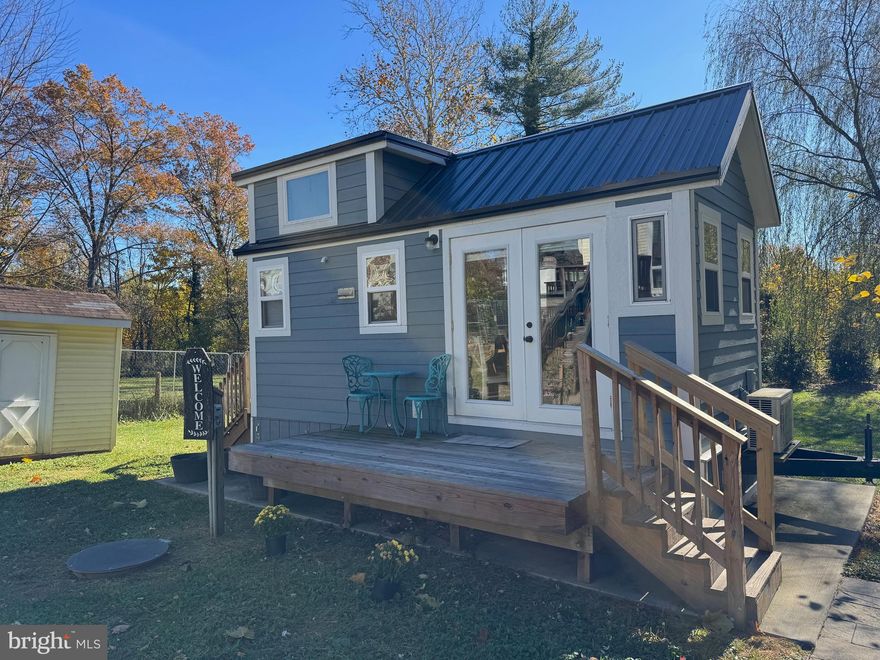 Tiny House living in the historic town of Round Hill. Cottage residence located in rear yard of established downtown home. Walking distance to gourmet grocery, post office, diner, and town park. Layout includes loft sleeping and living area with futon-style sofa. See pictures for full-size tub/shower and in home washer/dryer combo unit. Kitchen area includes cooktop, microwave, and compact refrigerator with fold up counter for dining. No smoking of any kind on premises (includes vaping and also covers any guests). Limited to two occupants.  Pets considered on a case by case basis. 

Pictured furnishings provided, could also be removed if preferred. First/Last month's rent and Security Deposit required. Min 650 credit score required