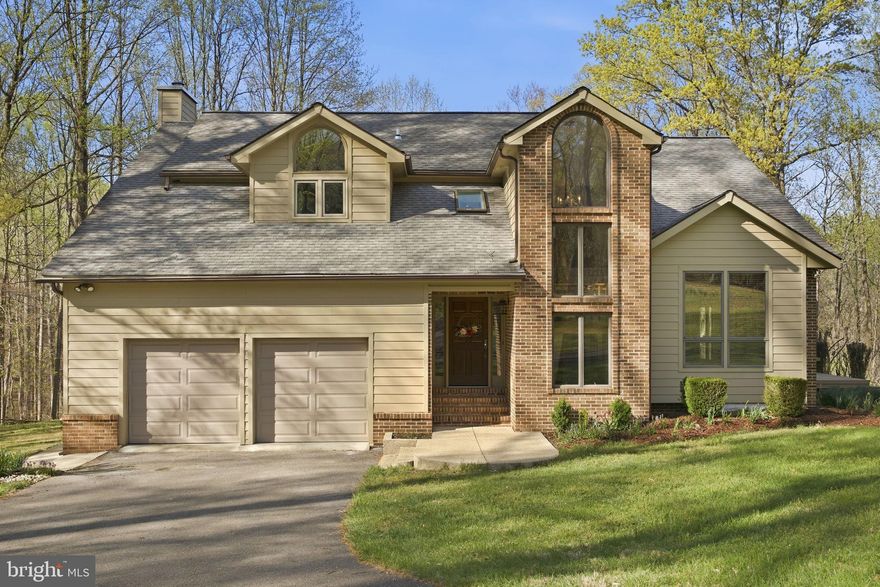 Set on 6.13 private acres, this beautifully updated home offers the perfect blend of space, comfort, and thoughtful upgrades. With 4 bedrooms and 2.5 baths, the home welcomes you with soaring ceilings and a sun-filled living room that immediately showcases its airy, open feel. The living and dining areas feature rich Brazilian hardwood floors and flow seamlessly for both everyday living and entertaining. The updated kitchen is a standout, complete with quartz countertops, new cabinetry, and high-end appliances, including a French door wall oven. Glass display cabinets with interior lighting and under-cabinet lighting add both function and style. Just off the main living spaces, two separate decks, one off the living room and one off the family room, provide ideal spots to relax and enjoy the surrounding privacy. The family room is warm and inviting, highlighted by a wood-burning fireplace and a distinctive sunburst wood accent wall.  The main level also includes a half bath and a recently updated laundry room with new cabinetry and countertops.
Upstairs, you’ll find four bedrooms and two full baths. The hall bath features a granite-topped vanity with a vessel sink and a shower. The spacious primary suite offers a walk-in closet and a private ensuite bath. The finished, partial walk-out lower level expands the living space with a tile floor, wet bar, and direct access to the backyard, perfect for entertaining, a rec room, or flexible living space. Plenty of room for a pool.
The exterior is equally impressive, with durable Hardie Plank siding, a large Trex rear deck. Additional features include a two-car garage with storage space, a shed, and a workshop with electricity, perfect for hobbies or projects. Recent updates include a new HVAC system (2025).
Ideally located in Harwood, Maryland, this home offers a peaceful, private setting with excellent accessibility, just 20 minutes to Annapolis, approximately 40 minutes to Washington, D.C., and convenient to major airports. Enjoy easy access to waterfront dining, boating on the Chesapeake Bay, scenic horse farms, and nearby golf courses.