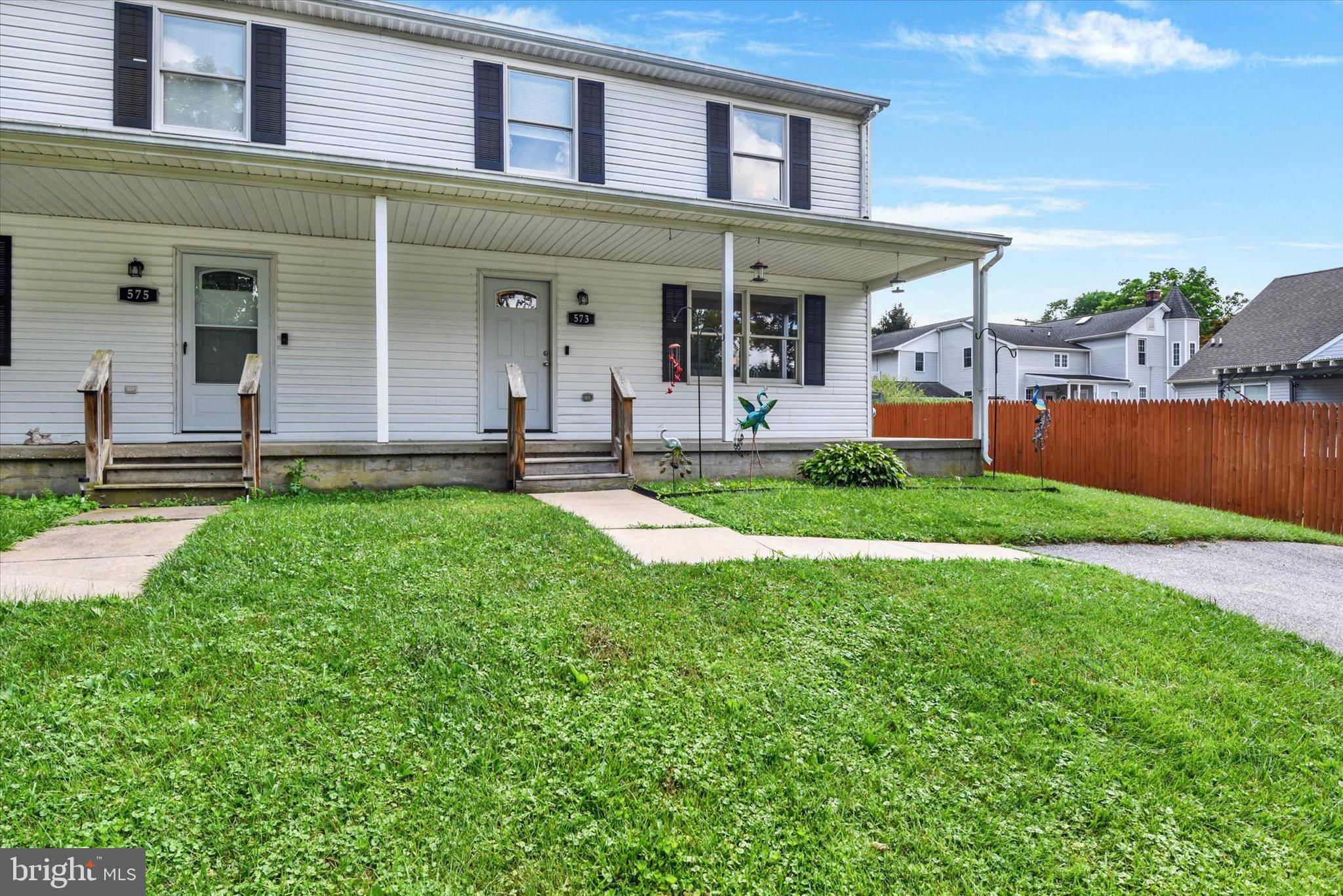 Quiet Country Setting and an incredible opportunity close to town but no HOA, a large yard and great off street parking for up to 4 cars. Fully renovated Duplex Townhouse Completely updated oak kitchen, updated baths, newer flooring, and freshened neutral paint, six panel doors, large deck and wide usable front porch. Full basement, ready to finish with a wide walk-up to the yard which is very deep. Located on a quiet dead end street with a handful of homes. This is larger than many comparable townhomes and features two full baths on the upper level. Finish the basement for more usable space. The panel box and service was updated 5 years ago.