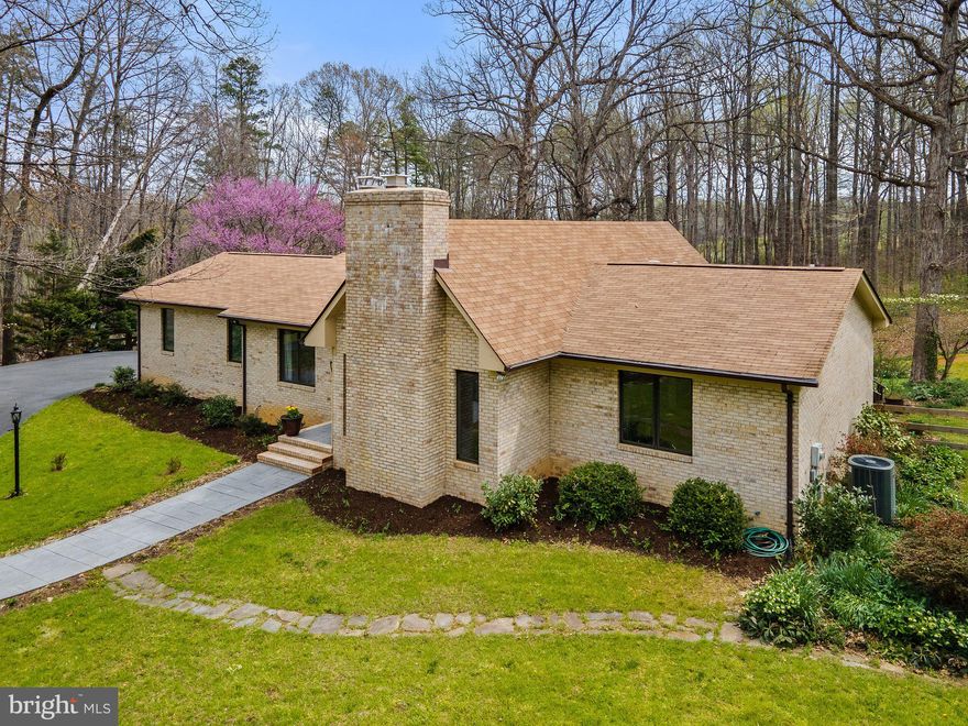 A RECIPE FOR RELAXATION The living is easy in this impressive, generously proportioned custom-built ranch-style home on an exquisite 5 acres!  Infinite outdoor space in the backyard offers enough breathing space for the biggest family gathering. The floor plan on the main level encompasses three spacious bedrooms, one of which is the primary bedroom with its own attached primary bathroom. There is a second full bathroom. You will also find a beautiful family room with a fireplace, a beautifully updated kitchen with quartz countertops, stainless appliances, and tile flooring. Enjoy time in the sunroom overlooking the private backyard. Soak in all that nature has to offer! Enjoy barbecues on the deck! Plenty of space to throw the best gatherings! You will find a fourth bedroom, full bath, family room, recreation room, and plenty of space for storage in the finished basement! Last but not least, this home has a two-car attached side load garage and Comcast Internet!