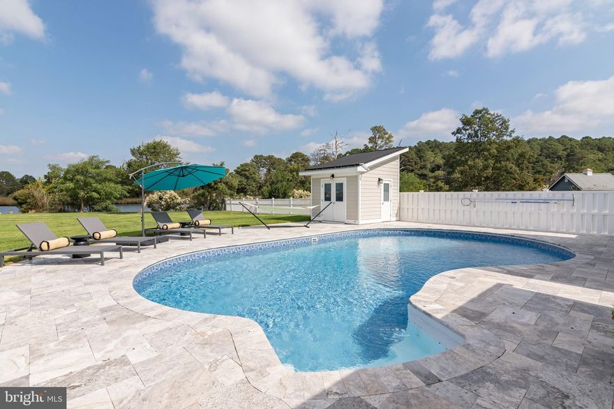 Welcome to Your Eastern Shore Waterfront Retreat. From 3 docks you can Boat, Kayak, or Paddle Board.
Deep Water Salt, Solar Heated Pool withTravertine Marble Surround. Outdoor Kitchen, Fish cleaning Station, 2 Boat Lifts, Pool house , Bathroom, etc.. Inside , a Gourmet Kitchen, Double Sided Wood Burning Fireplace,Open Floor Plan. First Floor Guest Suite with attached Bath and Second Floor Owners Suite with all comforts.,including second floor Laundry. Detached 2 car garage has a walk up staircase for expansion potential for Guest Apartment. Garage is heated and air conditioned. This is a Truly Remarkable Property. 45 minutes to Annapolis and 1 hour to Md. and De. Beaches