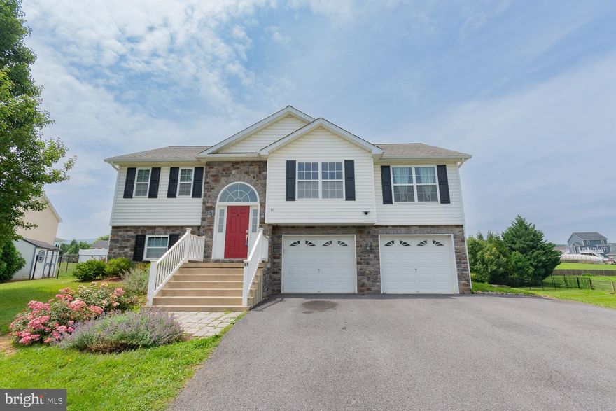 Charming Split Foyer located on a quiet cul-de-sac in the desirable Butler's Ridge Subdivision, this stone and vinyl split foyer offers both comfort and convenience. Just minutes from I-81, Berkeley Medical Center, shopping, and dining—perfect for commuters. This home features 3 bedrooms and 2.5 baths, with an open-concept main level that includes a vaulted ceiling in the living room and a modern kitchen with stainless steel appliances. Flooring throughout includes luxury vinyl plank, carpet, laminate, and vinyl. 
The finished lower level offers a spacious family room, laundry area, and half bath. Step outside leading to a fully fenced backyard with a patio, firepit, and storage shed. Don't miss your chance to tour this well-maintained home in a prime location!