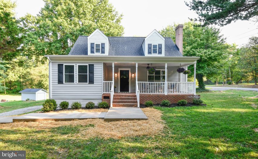 Simple and clean modernization in this Cape Cod style home.  Renovating this home has put new life back into it!   Cape Cod homes can be deceiving, but you'll not believe how spacious this home is once you enter.   What a gorgeous covered front porch the new owner will have for relaxing after a long day.  The main level hosts two bedrooms, a full bathroom and living room with picturesque bay window and wood burning fireplace.  As you  move through the living room, you enter the kitchen with gorgeous granite countertops, stainless appliances and custom cabinetry.  There is an eat-in area for your table to enjoy those fantastic meals with family and friends.  Upstairs really shows this homes character with both of the bedrooms having built in storage drawers and storage nooks in the eaves.  There's a large hall closet and full bath as well.  Enjoy entertaining in the basement recreation room with full bathroom, large partially finished storage area and 5th bedroom/library/media room/home office, NTC.  Large corner lot with dual entrance circular gravel driveway and 1 car garage.