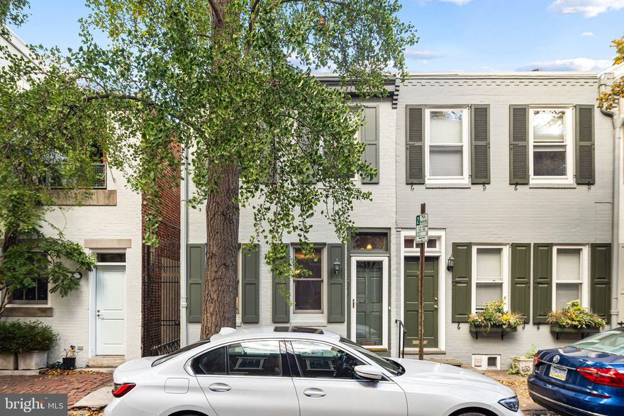 You'll fall in love with the picturesque, tree-lined block of Waverly Street along with the bright interiors and inviting outdoor space of this delightful 2 bedroom home. Enter a light-filled livingroom with large, custom windows, a built-in bookcase and a ceiling fan/light. Beyond the livingroom is a spacious diningroom that includes a built-in china closet and  huge window. A granite bar opening through an exposed brick wall views the the kitchen with marble counters,  good cabinet space, a large window and a French door leading to an enchanting patio. The 2nd floor features a generously sized, sun-filled primary bedroom, a new hall bath with a gorgeous walk-in shower and a second bedroom ( curently a home office) with excellent closet space. The  full, cement basement ideal for storage or future expansion, also houses the laundry with a washer/dryer. In addition to its bright interiors and inviting outdoor space, this perfectly located home offers easy access to the amenities of city living including  Schuylkill River Park, great restaurants and cafes and is a short distance to 30th Street Station, Penn and CHOP. Plus, it boasts a Walk Score of 97, Bike Score of 100, Transit Score of 93!