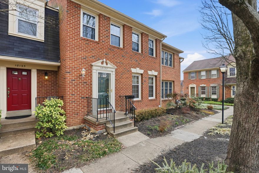 Beautifully updated brick townhome in the Village Knolls community offering an ideal commuter location in Oakton. This 3-bedroom, 3.5-bath home features a bright, open main level with refinished hardwood floors, recessed lighting, and fresh neutral paint throughout. Renovated kitchen includes white shaker cabinetry, granite countertops, stainless steel appliances, gas cooking, and subway tile backsplash. Spacious living and dining areas provide a flexible layout for everyday living or entertaining. Finished lower-level recreation room with a full bath, built-in shelving/workspace, and walk-out access to a private fenced brick patio. Conveniently located just minutes to the Vienna Metro (Orange Line), I-66, and major commuter routes, with easy access to shopping, dining, and parks. Well-maintained and move-in ready.