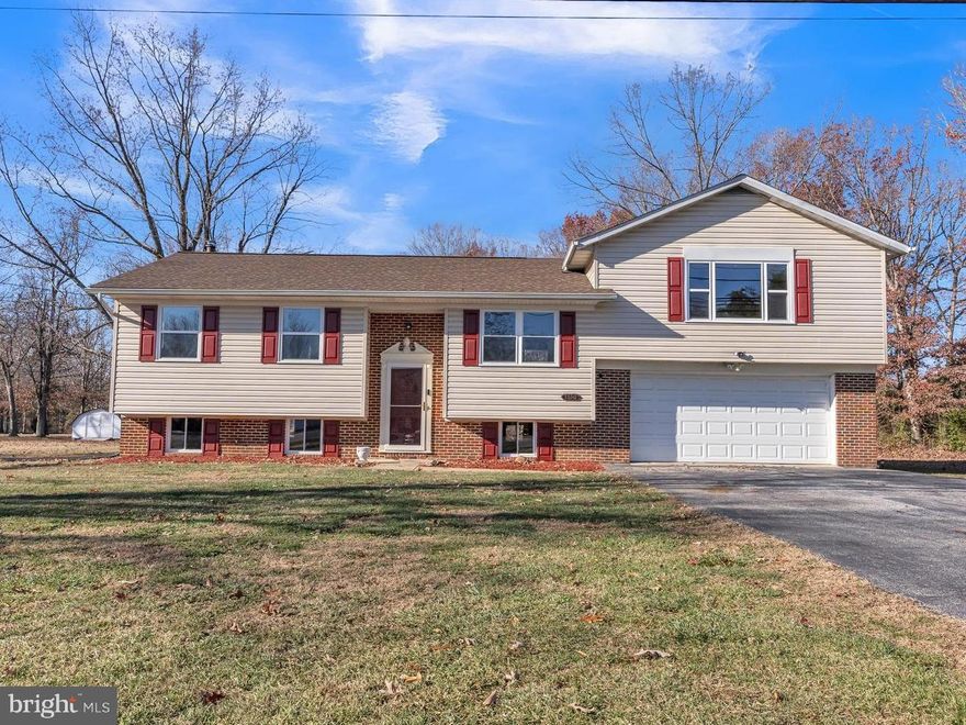 Welcome home! This house conveniently located in Pomfret, MD, got a fantastic makeover. Almost everything is new– flooring, fresh paint, shiny appliances, brand new HVAC system and new lighting throughout. But what makes this house special and sets it apart from competition is the PRIMARY SUITE. There's a big, cozy, private room that's like a secret hideout. It has its own fireplace that burns wood, recess lighting, spacious walk in closet, and a bathroom with a Jacuzzi-style tub. Plenty of space for storage/vehicles in the large attached 2 car garage. Enjoy the peace and tranquility overlooking your large 1+ acre yard from the brand new deck located just off of the kitchen. Hurry and you might get in before the Holidays-This one won’t last long!
