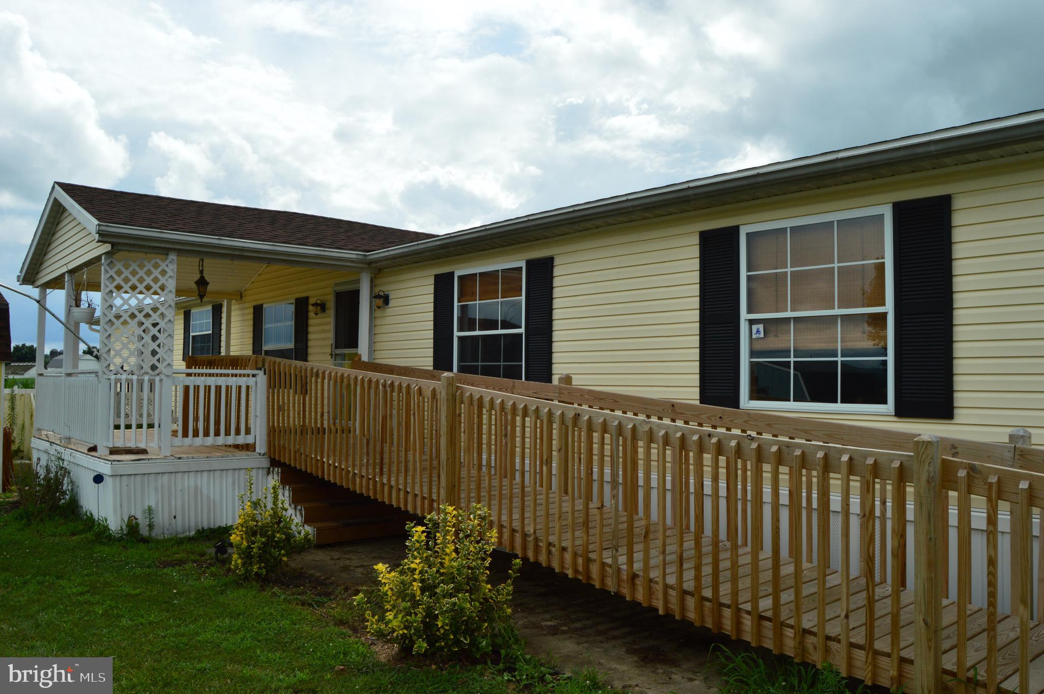 Welcome Home to this 4 bedroom 2 full bath mobile home in Victoria Manor Estates with over 2000 sq ft of living space. Beautiful updated kitchen with plenty of cabinet and counter space and newer upgraded stainless appliances. Spacious master bedroom with large closet, stand-up shower and double bowl vanity. Enjoy the country views and privacy relaxing on the back deck or the side porch. During the cooler months, gas fireplace in living room could provide additional warmth. Home has 4 bedrooms but office/den area could easily be used as a 5th bedroom if needed. Large ramp installed for easy access to home. Lot rent is 435/month, pets are welcome for an additional monthly fee. Easy Living in a Great Community!