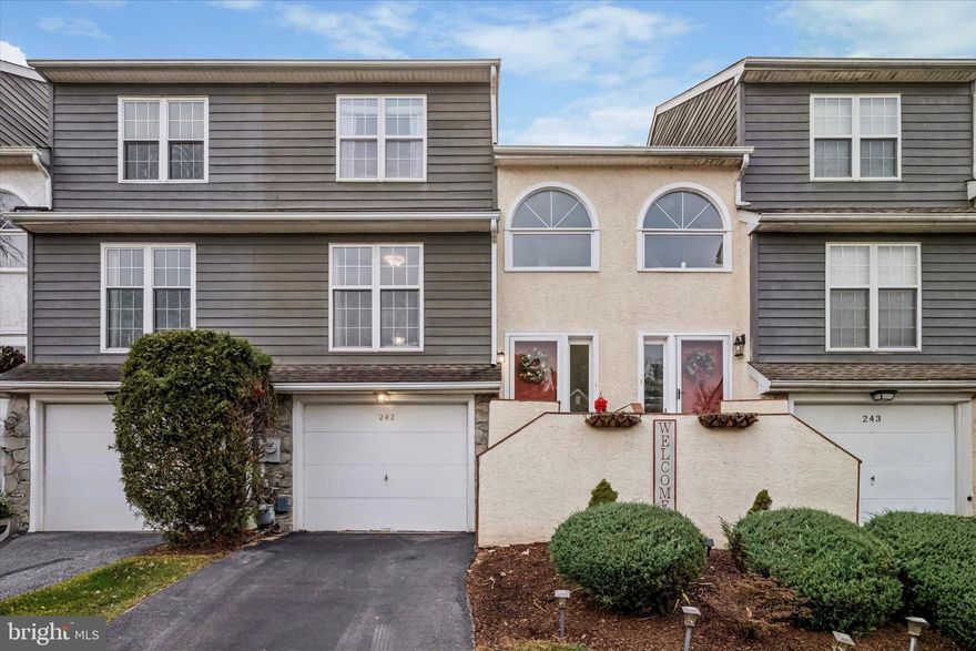 Welcome to this spacious townhome in the sought-after Ballinahinch neighborhood. Offering a bright, open floor plan & warm, inviting spaces and nearly new paint throughout; this home blends comfort, convenience, & style in every room. Enter through the welcoming foyer with hardwood floors & a dedicated area to hang your belongings. Walk up to the main level & enjoy stunning HW floors throughout & an airy layout designed for effortless everyday living & entertaining. The eat-in kitchen boasts classic wooden cabinetry, solid surface counters, tile backsplash, & an oversized window allowing natural light to pour in. Thoughtful architectural openings between the kitchen & dining room create a connected feel while still defining each space. The dining room overlooks the inviting family room, complete with a gas fireplace, bonus TV with mount, & sliding doors that lead to the rear deck — perfect for morning coffee or evening relaxation. A convenient powder room & a large coat closet are also located on this level, adding practical everyday function without interrupting the open flow. Upstairs, you’ll find two generously sized bedrooms with abundant closet space. Walk into the primary bedroom through the double door entry & find carpeted flooring, overhead light/ceiling fan, ample windows, walk-in closet & an en-suite full bath. The primary bath features glass door shower, functional vanity with solid surface counters, tile flooring & accent shelving. The second bedroom also features carpeted floors, overhead light/ceiling fan & bonus TV with mount. The second full bath features a classic design with tub/shower, tile floors & single sink vanity. Finally, a hallway linen closet & the upper-level laundry with bonus shelving adds extra daily convenience. The finished lower level offers incredible versatility with carpeted floors, recessed lighting & direct access to the one-car garage. Use this flexible space as a family room, home office, guest room, or playroom — whatever fits your lifestyle. Additional highlights include HOA amenities such as tennis courts & playground plus a 1-year home warranty for the Buyer!! Enjoy a prime location within walking distance to Barnaby’s, just a few minutes drive to Media Borough & easy access to major highways, SEPTA, shopping, dining, & entertainment. This wonderful home is move-in ready & waiting for its next chapter. Don’t miss your opportunity to make it yours.