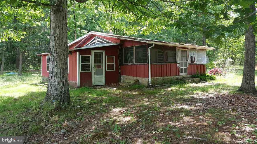 1 Bedroom Home located on a wooded 1 acre + lot. This home does require some work but in overall solid condition and priced to move/sell quickly! Home is being SOLD "AS-IS"