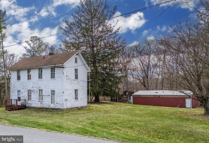Live authentically. Rare opportunity to own 1.22 acres with large views of the Western Run River. Steeped in history, the circa 1892 white toll house for the area still exists. New roof 2009. Renovate this interesting piece of history or start over with a new build of your making. Red one story barn conveys with the property. The location is one that will nourish your soul for many moons to come. Commune with nature in this glorious spot with an eagles eye view. This property sits in the center of two contiguous properties that are also available (MLS#  MDBC2126102 and MLS#  MDBC2083376). Interesting opportunity. The art of uniting human and home. Cultivate your existence.