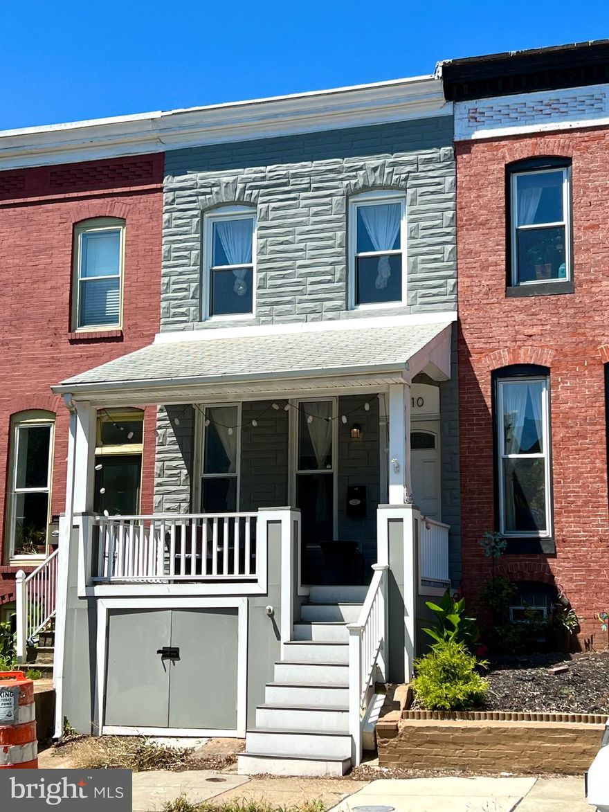 FULLY FURNISHED! Beautifully renovated porch front Federal style home in the heart of Hampden offering 2 bedrooms,  3 full bathrooms, one half bath, private parking pad, and a fully finished basement with flexible living space. The main level features hardwood floors, an eat in kitchen with granite countertops, stainless steel appliances, and recessed lighting. Upstairs includes two spacious bedrooms each with a full bath, plus a rear TREX deck for outdoor enjoyment. The lower level includes a family room, built ins, full bath, and laundry area, ideal for guests, home office, or in law suite. Updates include a new water line and copper plumbing. Enjoy the charm of the covered front porch and easy access to local favorites along The Avenue, Wyman Park, the Rotunda, and the famous Miracle on 34th Street. Convenient to Johns Hopkins, the light rail, and just minutes from I83 for a quick commute.