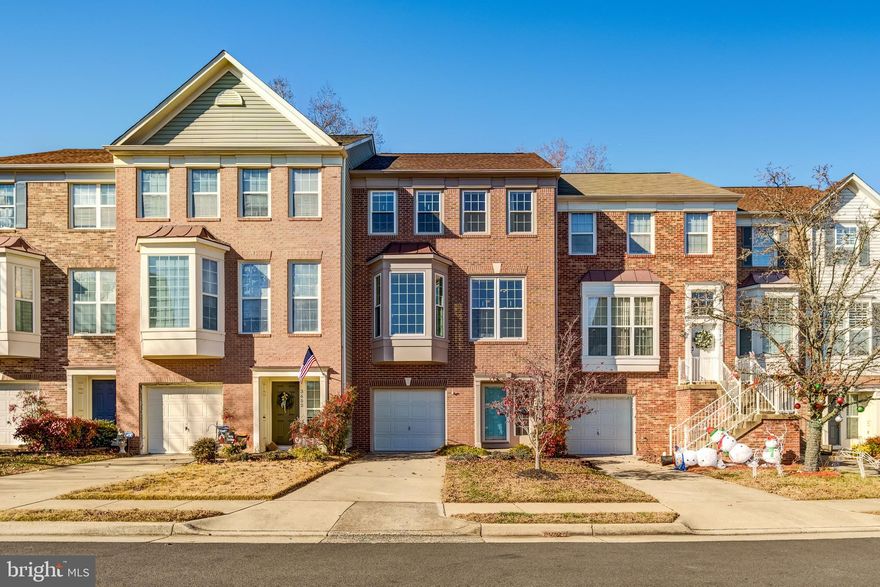 Welcome home!  This beautiful townhome, with seasonal views of the Occoquan River from both the front and the back of the house, is located in desirable Lake Ridge and will not last long!  Upon entering the home you will find a spacious entry way with hardwood floors and access to the 1 car garage.  There is also a large rec room/family room and a half bathroom.  From the entry level there is walkout access to the fully fenced back yard and patio backing to trees.  On the main level there are hardwood floors and high ceilings throughout.  The updated kitchen includes stainless steel appliances, abundant cabinet space, a pantry, a breakfast bar, and an eat in area.  The open floor plan allows the spacious dining area to flow into the large living room which includes a gas fireplace.  From the living room you can access the deck and enjoy lots of sunlight from the large windows and doors.  There is also a half bathroom on the main level.  Upstairs you will find 3 bedrooms, including the primary bedroom with a cathedral ceiling and walk-in closet.  The attached primary bathroom is beautifully updated and includes a soaking tub, stand up shower, and two sinks.  The second and third bedrooms are sizable and the hallway full bathroom has been updated.  Amenity filled Lake Ridge includes 5 outdoor pools, a splash pad, 2 community centers, numerous playgrounds, sports fields/courts, and walking/jogging/biking trails. Additionally, the community provides easy access to shopping, dining, and entertainment, including proximity to Potomac Mills and Stonebridge at Potomac Town Center. With easy access to I-95 and the Express lanes, as well as a variety of commuter lots and bus systems, this home is perfectly located for an easy commute to Ft. Belvoir, Quantico, the Pentagon, Alexandria, Arlington, and Washington, DC. Schedule your showing today!