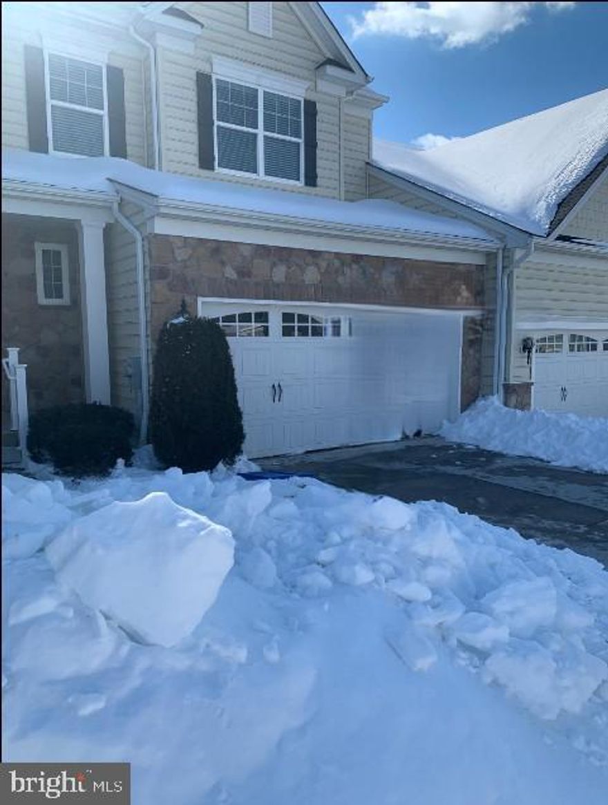 Discover a charming townhouse designed for comfort and convenience in a vibrant senior community, where the age requirement is 55 and better. This beautifully crafted Colonial-style home, built in 2017, features 3 spacious bedrooms and 2.5 bathrooms, providing ample space for relaxation and entertaining. Enjoy the ease of living with an attached garage and a paved driveway, ensuring hassle-free access. The well-maintained exterior, with a blend of brick and vinyl siding, invites you in. Inside, the open layout offers a warm ambiance, perfect for creating lasting memories. The unfinished basement presents an opportunity for customization, whether for storage or a personal retreat. With an association that includes snow removal, trash, and lawn maintenance, you can spend more time enjoying your surroundings. Embrace a lifestyle of comfort and community in this delightful home, where every detail is designed to enhance your living experience.