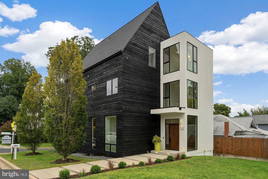 Offers Due Tues. @ 3pm. Stunning Modern Jewel Box in Urban Cherrydale, designed and renovated by Sagatov Design+Build in 2015.  Come fall in love with this fully renovated 5 bd 4.5 bath 3 level modern home with roof top deck off 3rd level entertaining area. Home is finished with high end fixtures, custom marble faceted island in the kitchen, hard wood on all three levels, architectural steel and wood stair tower,  and luxurious owner's suite. A light filled foyer with custom entry built-ins welcomes you to this home. Main level includes an open floor plan that includes the living room, dining room and kitchen. The second level houses the owner's suite that is outfitted with a large walk-in closet, dressing area and luxurious bathroom with double sinks, & large all glass shower with two shower stalls. Two secondary bedrooms and a hall bath complete the second level. The third level includes a large vaulted entertaining room, wet bar, fridge with ice maker and access to the roof top deck with eastern views towards DC. A fourth bedroom and full bath complete the third level. The lower level includes a rec room, 5th bedroom, 4th full bath and spacious laundry room. Enjoy coffee or an evening dinner on the outdoor porch. House was expanded and fully renovated in 2015. All new HVAC, Hot Water heater, and roof. The detached two car garage is being sold "As-Is" as it was never touched or renovated but would be perfect if you wanted to rebuild with an additional office space above or studio or suite.