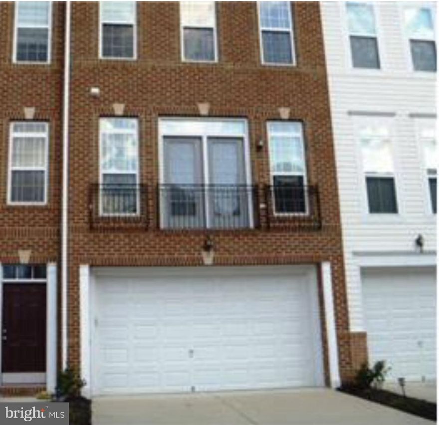 Freshly painted, brick front, end unit 3 level spacious townhouse with nice upgrades.  Located in a gated community with many amenities.  Two car garage, vaulted ceilings, hardwood floors, gorgeous gourmet kitchen, 3.5 upgraded baths, deck for outside sun and morning coffee.  Close proximity to metro rail.  Easy commute to downtown DC, VA, military bases, National Harbor and shopping.   Application fee will be reimbursed.
