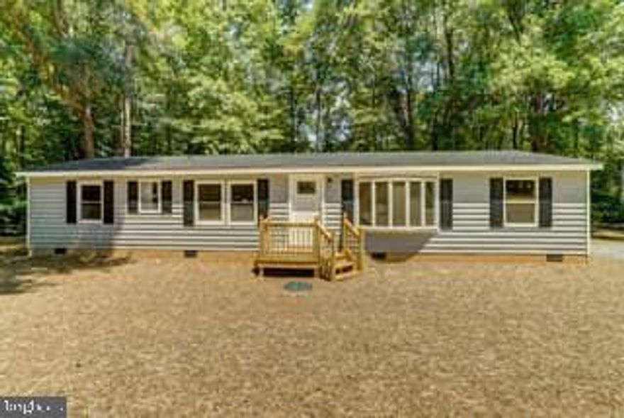 Welcome Home! This home was completely renovated in 2019 and sits on just over 7 acres in Louisa County. Enjoy your private, country retreat while also having the convenience of being under 3 mile to I-64 for easy commuting. One level living with primary bedroom along with two more bedrooms and full bathroom and jack and Jill bathroom. Walk outside onto your large deck overlooking your very own, private pond with your own dock to fish off of. There is plenty of parking in the graveled driveway. Come see it for yourself! Home is being sold as-is and does not qualify for loans. Cash only offer. There is a tenant with a lease signed until 4/5/2024.