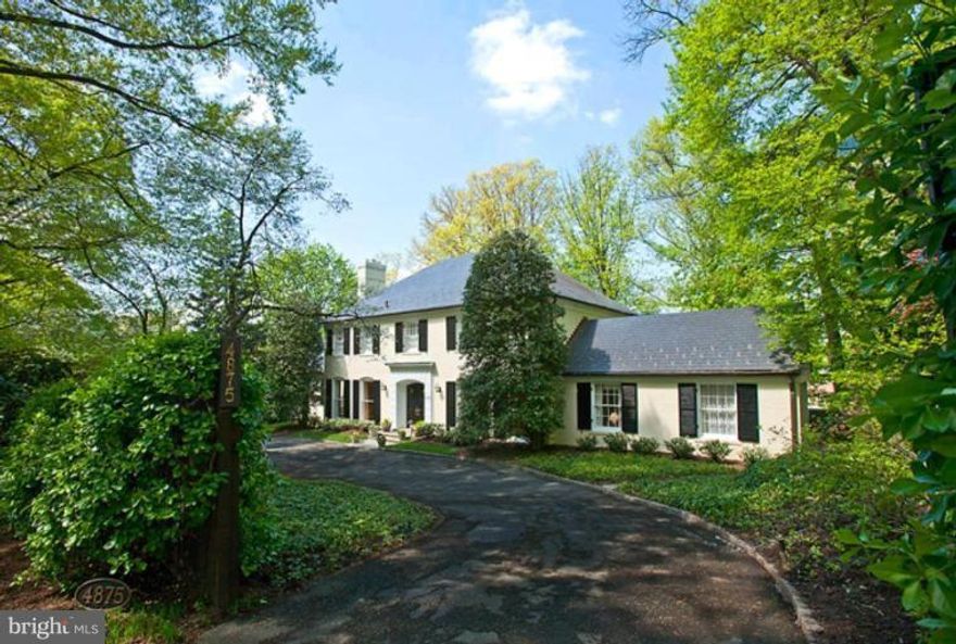 Brokers open 3/25 12 - 1:30! Discreetly hidden from street; elegant, comfortable Georgian w/generous living & dining rms, ideal for entertaining. 1st flr fam rm, cheerful kitchen & brkfst rm; lovely 1st floor master ste w/dressing rm & fireplace and 4 lg BR/2 BA up.  Large, finished lower level; landscaped, pool-sized garden (18,000SF lot). Circular drive w/2 car garage + EZ parking for 8-10 cars.