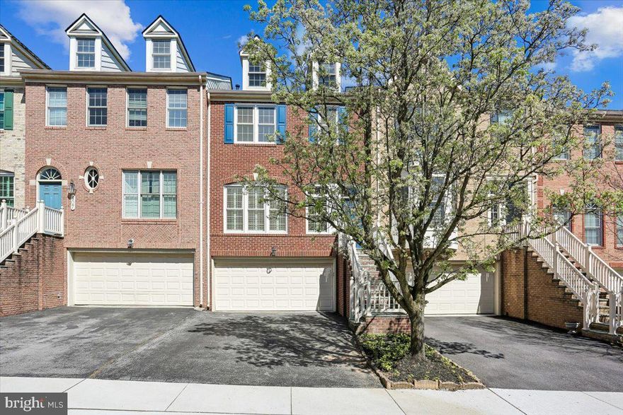 OPEN SUNDAY 4/12 1-4PM.  Completely transformed 3BR/3.5BA luxury brick townhouse with walk-out lower level and two-car garage built by Magruder Companies in Rose Hill Falls.  THE FIRST OF ITS KIND with a completely wide-open main level floorplan of only perimeter walls.  Approximately 2,200 square feet of living area on three levels. Special features include 9-foot, 10-foot, and vaulted ceilings; skylights; refinished oak hardwood flooring throughout the main level and much of the upper level; new stamped-pattern carpeting; all new kitchen with custom cabinetry, porcelain counters, subway tile backsplash, massive center island with a waterfall countertop, and stainless appliances; all remodeled or renovated bathrooms; recessed lighting; detailed molding package and custom window treatments throughout. Wonderful outdoor space highlighted by a maintenance-free Trex deck with vinyl railings, privacy panels, and flagstone patio under the deck with vinyl porch ceiling and ceiling fan overlooking the fenced yard. Brick and flagstone stairway and stoop with vinyl railings; marble foyer entrance with new chandelier and coat closet; chic open main level with versatile floorplan allowing for informal dining area or sitting area in the front of the home with floor-to-ceiling windows and plantation shutters; at the center of this level boasts an all new chef’s kitchen with tile flooring, custom cabinetry, porcelain countertops, subway tile backsplash, stainless KitchenAid & JennAir appliances, recessed lighting, pantry cabinets with slide out drawers, and center island with waterfall countertops and pendant lighting; the rear of the main level features an open family room concept with flagstone fireplace, raised stone hearth, built-in firewood storage niches or bookshelves, a workstation/study area, a pantry closet with opaque glass barn door, and sliding glass doors to Trex deck; remodeled powder room with marble flooring; solid oak staircase to upper level hallway with vaulted ceiling, skylights, and recessed lighting; spacious primary bedroom suite with vaulted ceiling, ceiling fan, sitting area, and cedar walk-in closet; renovated primary bathroom with designer tile flooring, vaulted ceiling, skylight, recessed lighting, two vanities with porcelain countertops and lighted mirrors, separate water closet, and huge walk-in shower with frameless glass enclosure, designer tile shower floor, and subway tile wall surround; two additional bedrooms with vaulted ceilings, new carpeting, and double-door closets; remodeled hall bath with new LVT flooring, new double vanity with marble countertops, and ceramic tile tub surround; upper-level laundry room with high-efficiency top-load LG washer and dryer; walk-out lower-level recreation room with recessed lighting, LVP flooring, and French doors to flagstone patio under the deck; remodeled ceramic tile full bath; foyer access to two-car garage with built-in cubbies and bench seating; updated systems and structural throughout including Bryant Evolution HVAC, architectural shingle roof, and new Thompson Creek windows with-50 year warranty. Without leaving the neighborhood, there are over a mile of bucolic walking/bike paths, forested conservation areas, sidewalks, two tot lots, a private tennis court, and a basketball court.  Adjacent to the development sits the City of Rockville's Bullard Park at one end of the neighborhood and all of the sports fields, track, and tennis courts of Julius West Middle School on the other side.  Be part of the vibrant Rockville Town Center featuring shopping, fine restaurants, sidewalk cafes, the Rockville Regional Library, Regal Cinemas, and other entertainment and cultural facilities.  Less than a mile from the Rockville Metro (Red Line) for those looking to commute via mass transit.