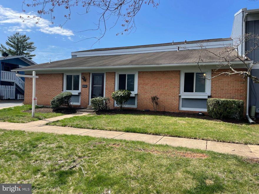 All offers are due by Tuesday, 4/1, at 2PM. 
Community, Convenience, Value and Opportunity come together in this 2BR, 1BA semi-detached, townhouse-style condo on one level with off-street, covered Parking Space and private, fenced-in Patio. Up the walkway and large front lawn brings you into the open main level with Living Room and separate Dining Area.  From the Dining Room, step into the Kitchen with pantry or outside to the private, fenced-in Patio. Head down the hallway to your 2 good-sized Bedrooms as well as full Bathroom and walk-in Laundry + Mechanical Closet with side-by-side washer/dryer and space for storage. Move in as-is or bring your personal touch to renovate the Kitchen, Bathroom and floors to your liking. Updates include painting, new water heater and plumbing repairs in 2025, new stove and refrigerator in 2024 and new washer/dryer in 2023. The private, covered parking space also includes an area with secure storage. The condo fee of $358 includes water, lawn care, exterior maintenance, trash removal and professional property management. Located just off Route 28, under a mile to the Manassas Park VRE train station, and less than 10 minutes to historic, old town Manassas, this quiet neighborhood brings together the best of urban, suburban and country with retail, restaurants, parks, schools nearby and easy access to DC, Tysons, Shennandoah & countryside.