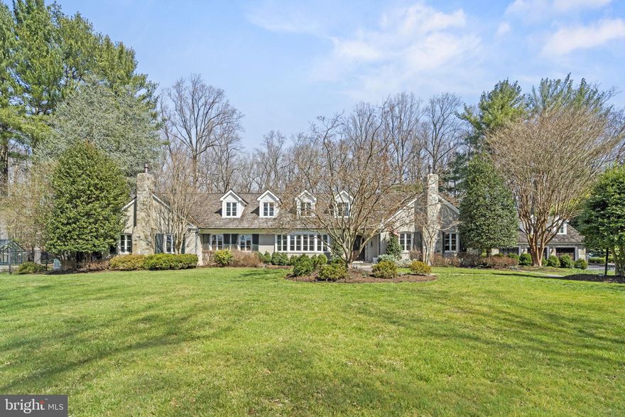 Have you ever dreamed of living in one of the charming stone villages in the Cotswold's outside of London?   This home will make you think you are there!   Set back off the street on a long private drive with a lush, rolling front yard filled with yellow daffodils, the exterior beauty of this home is only matched by the charm and attention to detail you'll find inside. Come through the distinctive, custom arched hardwood front door and into the welcoming front-to-back Foyer with polished hardwood floors. To the right of the entry you'll find the sun drenched Library with expansive windows and custom built-ins and a stone gas fired fireplace.  To the left of the Foyer is the formal Living Room currently used as a Billiard Room.   Adjacent to this is the parlor/game room with substantial moldings, a sweet window seat and reclaimed, antique stained glass doors from a British Pub along with a "tin" ceiling.  It feels like you are in England!   The spacious Family Room with a gas fireplace with a stone surround has a custom built bar with extensive wood carving and stunning wide plank architecturally salvaged floors.  The upper Family Room has the most gorgeous, thick, rough hewn beamed ceiling and three walls of Palladian windows highlighting the stunning setting.   Doors from the Upper Family Room/Conservatory open to the Covered Porch  with an outdoor television, ceiling fans, flagstone flooring  and a wonderful vista of the pool surrounding terrace and gardens.  The Gourmet Kitchen with all new top-of-the-line Viking appliances, a center island, quartz countertops and a breakfast bar opens to the Dining Room.   The Dining Room has walls of built in book cases perfect for displaying treasured china or collectibles and a gas fireplace.   Dual glass sliding doors lead to the Sunroom/Florida Room providing bountiful natural light. Finishing out the main level is the Laundry/Mudroom with two washers and dryers and ample storage space. Upstairs the sumptuous Primary Suite offers Bedroom, Sitting Room, Two Separate Full Bathrooms and extensive closet space. Three more Bedrooms and Full Bathrooms complete the upper level. Downstairs in the Lower Level you'll find an excellent Media/Recreation Room with a Full Bathroom with a steam shower and a Sauna. The backyard is an entertainer's dream with the covered porch, a handsome flagstone terrace with a custom fountain, stone retaining walls and privacy.  The home gardener  with the green thumb will adore the English style greenhouse!   This home is just as exceptional outside as inside.   The separate stone Carriage House is comprised of an oversized three car garage with a workshop area along with a private Guest Suite with a Kitchen, full bath, vaulted ceiling Family Room and separate Guest Bedroom.  This, too, has terrific outdoor space with a stone patio and fire pit.  Upgrades include new Pella windows throughout (Conservatory are Anderson), refurbished pool in 2021 with speckled plaster and a natural gas heater, a new "elephant" safety cover w/ a baby fence.  Heavy Cedar Shake roof installed in 2013, copper gutters, a 22 zone irrigation system, LED landscape lighting, low voltage lighting around the pool, front yard & driveway.  Ideally located in one of Potomac's most desirable neighborhood's, Potomac Falls, this home truly offers an incredible lifestyle.   Step away from the hub-bub of the working world and escape to your own very private estate.  It's exquisite!  Close to the C&O Canal for outdoor hiking, biking and kayaking and minutes to Potomac Village for everyday shopping, this home also offers easy access to the Clara Barton Parkway and I-495! Churchill school cluster incl. the popular Potomac Elementary.  Call for your private appointment.  You won't be disappointed!  Note: Main House is 4 BR/5FB; Guest House 1 BR/1 FB.