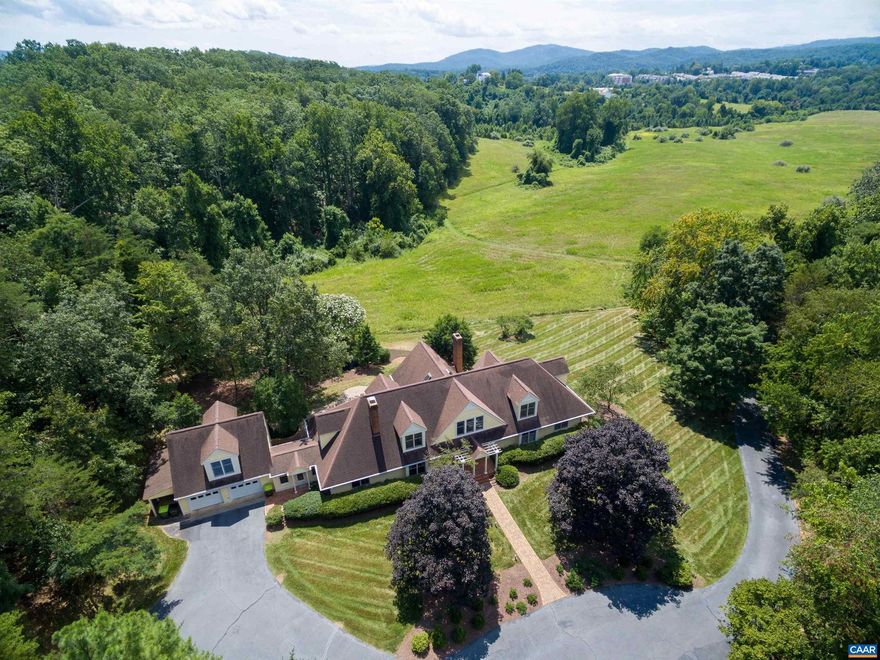 This captivating property, nestled on a private 3.28 acres, offers a harmonious blend of luxurious design & idyllic natural surroundings. The 1st-floor master suite offers picturesque views of a rolling pastoral field that stretches towards beautiful mountains. A gourmet kitchen features sleek countertops, abundant cabinetry,  stainless appliances & a cozy breakfast area. A family room, study, three additional bedrooms & an-over-the-garage office make this a versatile floor plan. The heart of the home is the living room, where comfort meets grandeur. Soaring ceilings create an airy ambiance, inviting abundant natural light for hosting a gathering or enjoying a quiet evening by the fireplace. See the list of many improvements/upgrades in the documents section. You'll enjoy a sense of community and access to Charlottesville?s best that cater to every facet of your lifestyle, whether it's leisurely strolls along scenic streets, a quick trip to the nearby farmer?s market, or many restaurants & shops.,Solid Surface Counter,Wood Cabinets,Fireplace in Family Room,Fireplace in Living Room