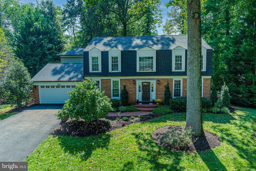 Introducing an exceptional offering in the coveted Langley Oaks neighborhood. Nestled on a generously sized private lot, this meticulously renovated colonial beautifully balances classic charm with contemporary convenience. Boasting 4 bedrooms, three full baths, and two half baths, this home is a testament to refined living. Step inside and experience a seamless blend of tradition and modernity. The main level welcomes you with spacious rooms that effortlessly cater to both entertaining and day-to-day living. An open living room sets the scene, while an expanded formal dining room provides ample space for memorable gatherings. The family room, complete with a warm and inviting fireplace, offers a picturesque view of the stunning backyard. The gourmet kitchen is thoughtfully designed to provide both versatility and functionality, and it also hosts a breakfast nook that opens up to the stunning newly hardscaped backyard. The boundary between indoors and outdoors fades with four sets of doors that invite the natural beauty inside. Upstairs, the second level hosts four bedrooms and two full baths. The elegant owner's suite steals the spotlight, meticulously renovated and adorned with a walk-in closet and a luxurious en-suite bath. The lower level provides flexibility, encompassing a recreation room, an home office or gym, and a full bathroom. Step out to an enchanting yard featuring a large flagstone patio- a wonderful extension of the indoor living space. The lushly landscaped yard completes the picture-perfect setting. Located less than 2 miles from downtown McLean and less than 8 miles from Washington, DC, this locale offers unmatched convenience. Commuters will be pleased with the proximity to I-495, the GW Parkway, and metro stations, ensuring easy access to major destinations throughout the region.