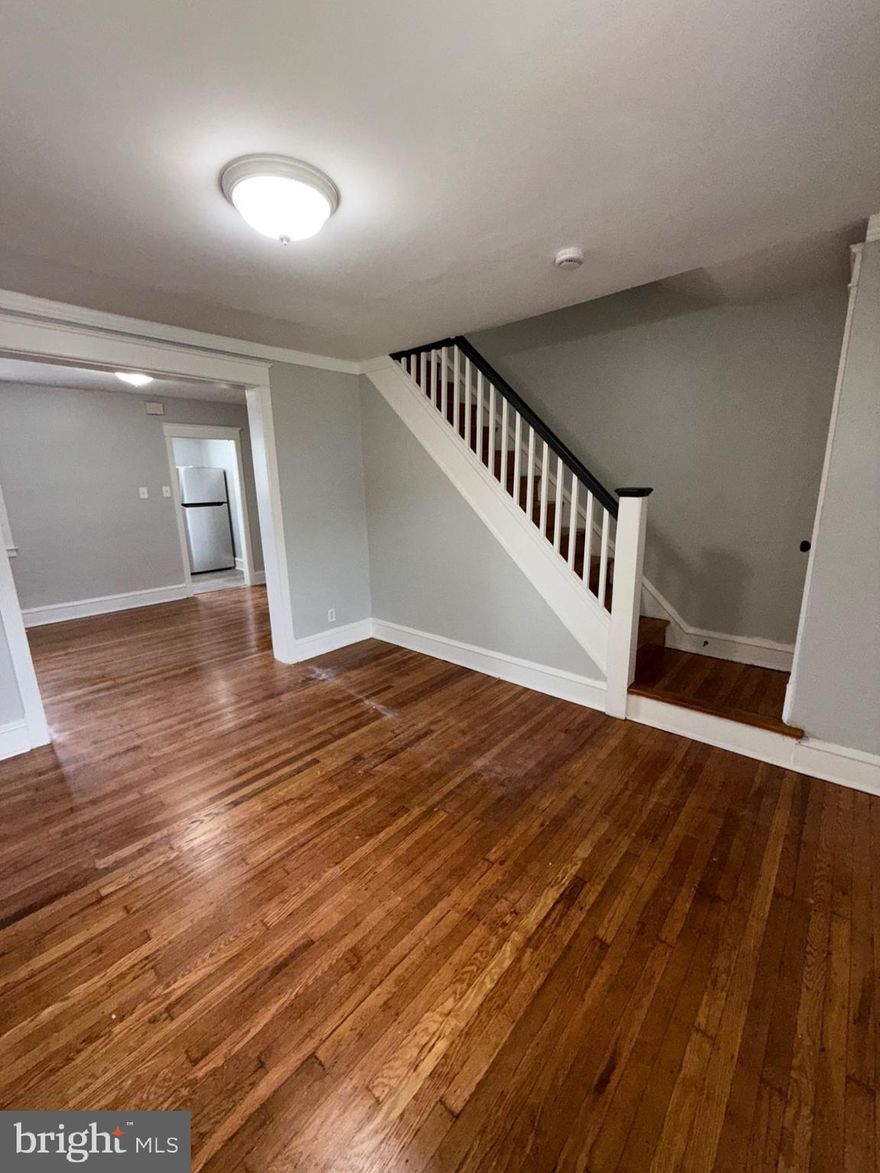 Beautiful house with refinished hardwood floors. Large Living Room with separate dining room.  Renovated Kitchen with new appliances. New front porch. Two large bedrooms and modern bathroom. Full basement. Separate storage room in rear! Ready to move in!